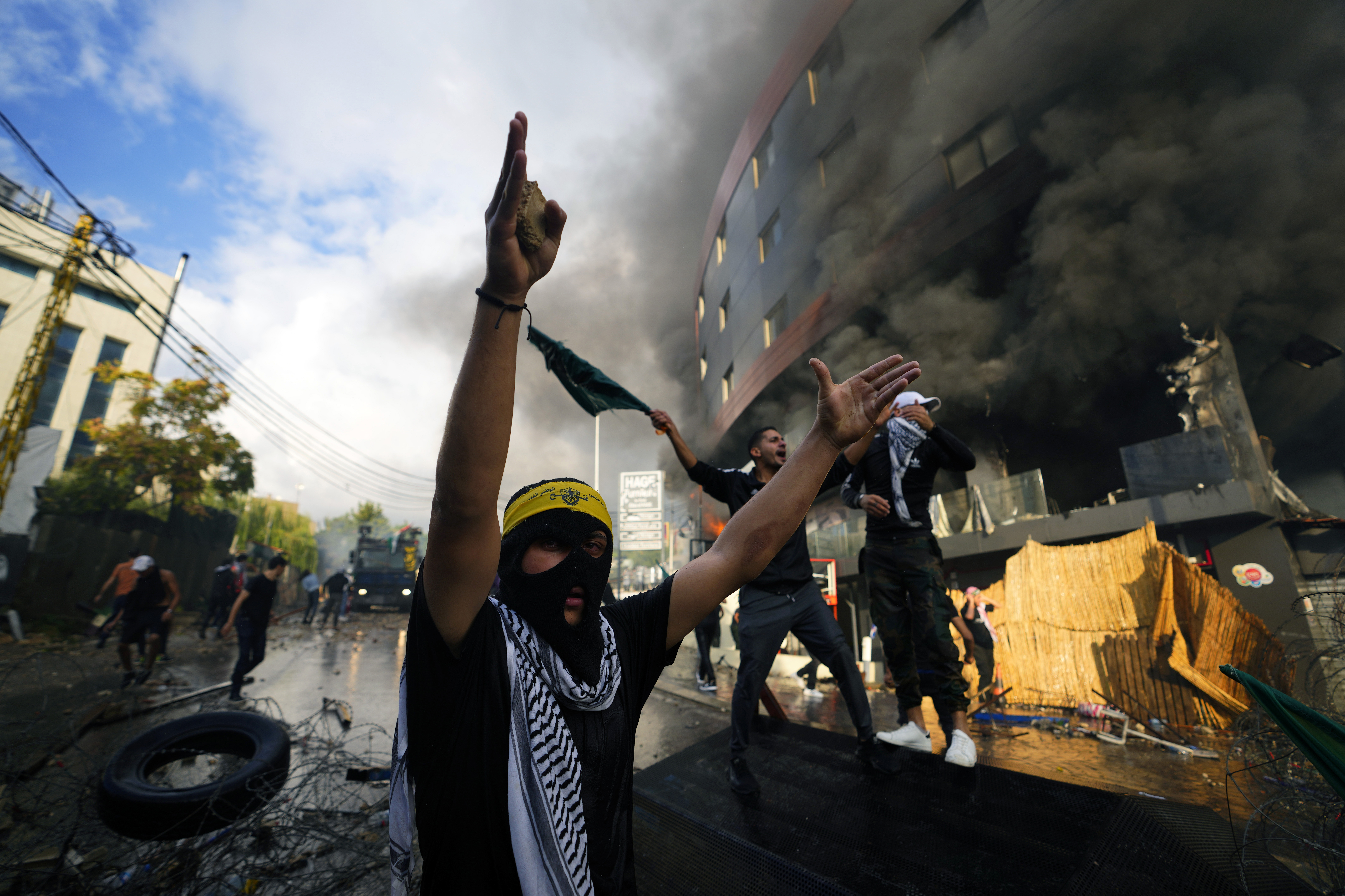 Protesters chant slogans during a demonstration in solidarity with the Palestinian people in Gaza, near the U.S. embassy in Aukar, a northern suburb of Beirut, Lebanon, Wednesday, Oct. 18, 2023 