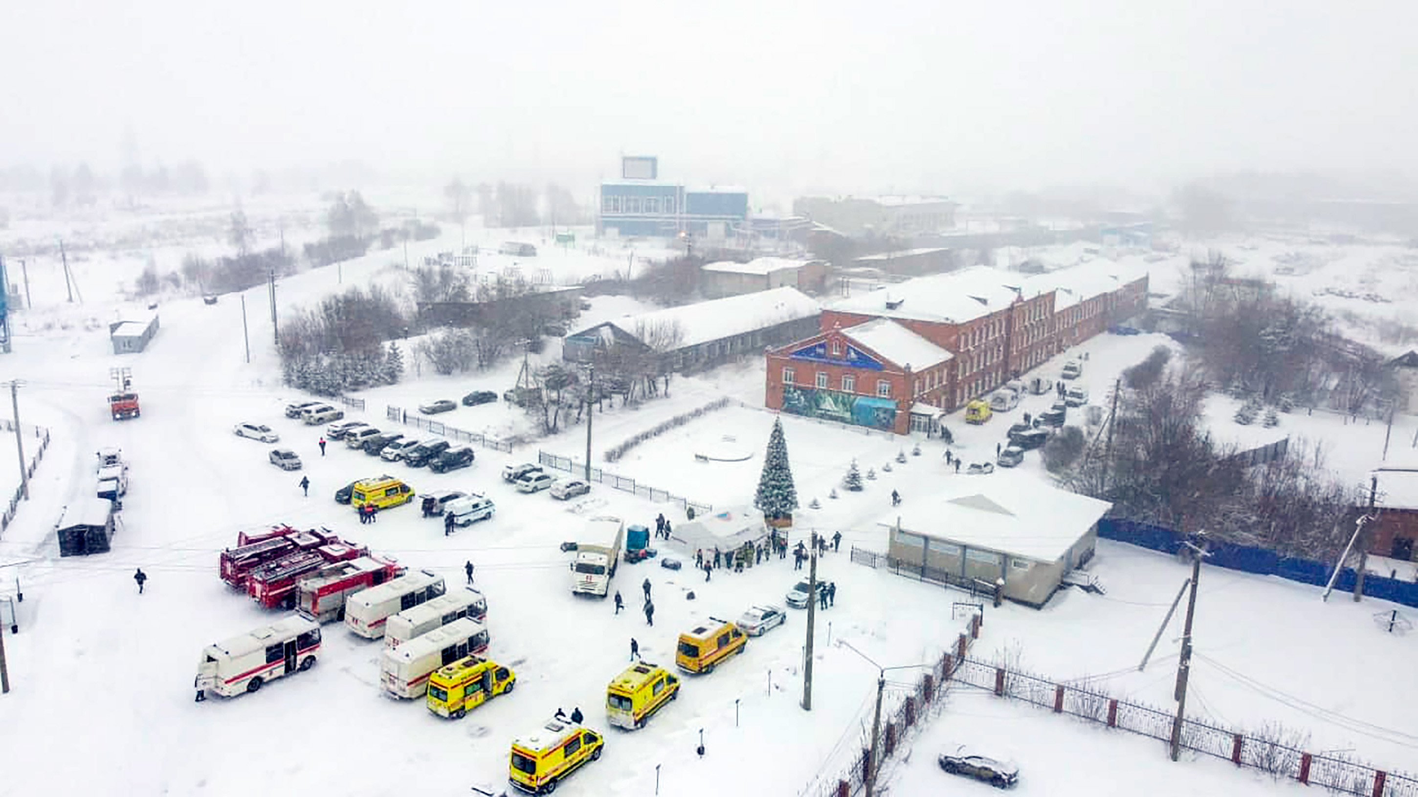 Ambulances and fire trucks are parked near the Listvyazhnaya coal mine out of the Siberian city of Kemerovo