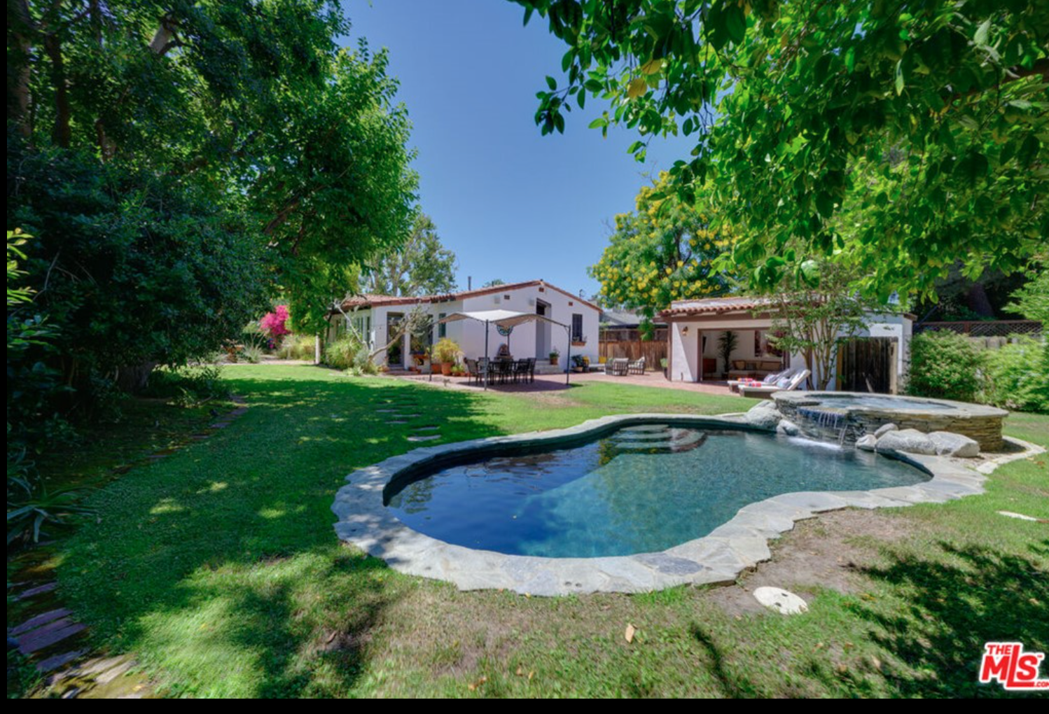 The pool and spa in the home's private backyard.