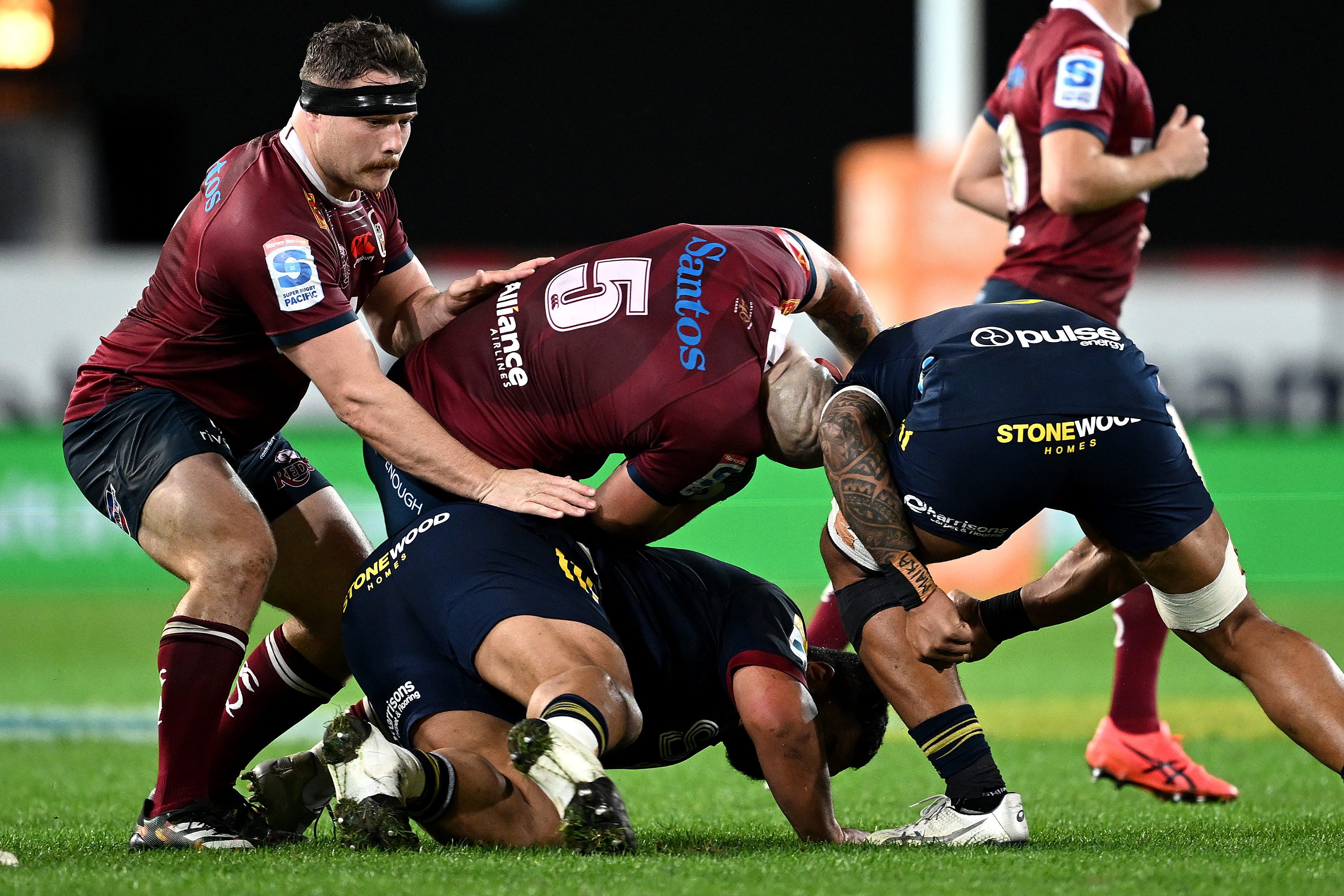 Queensland Reds player Connor Vest's neck contorts after contact with Shannon Frizell of the Highlanders.