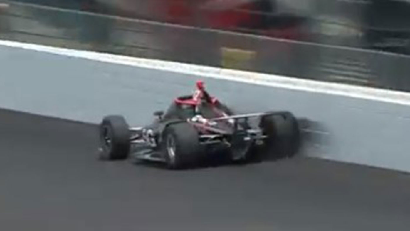 Will Power touches the wall during qualifying for the Indy500.