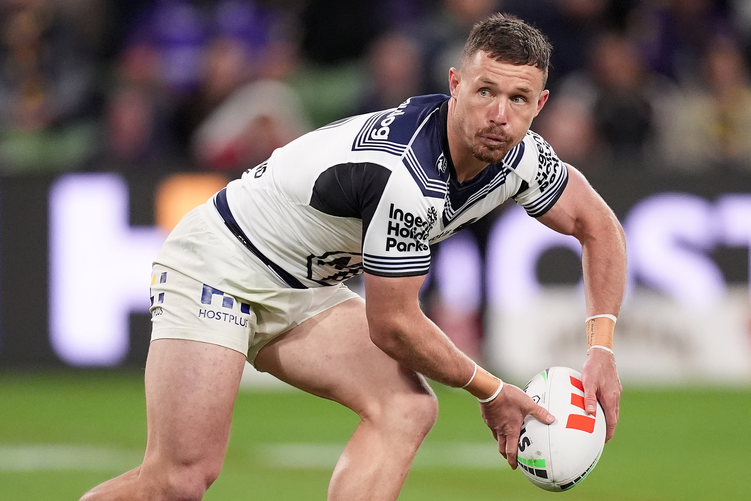 Damien Cook of the Rabbitohs passes the ball during the round eight NRL match between Melbourne Storm and South Sydney Rabbitohs at AAMI Park on April 25, 2024, in Melbourne, Australia. (Photo by Daniel Pockett/Getty Images)