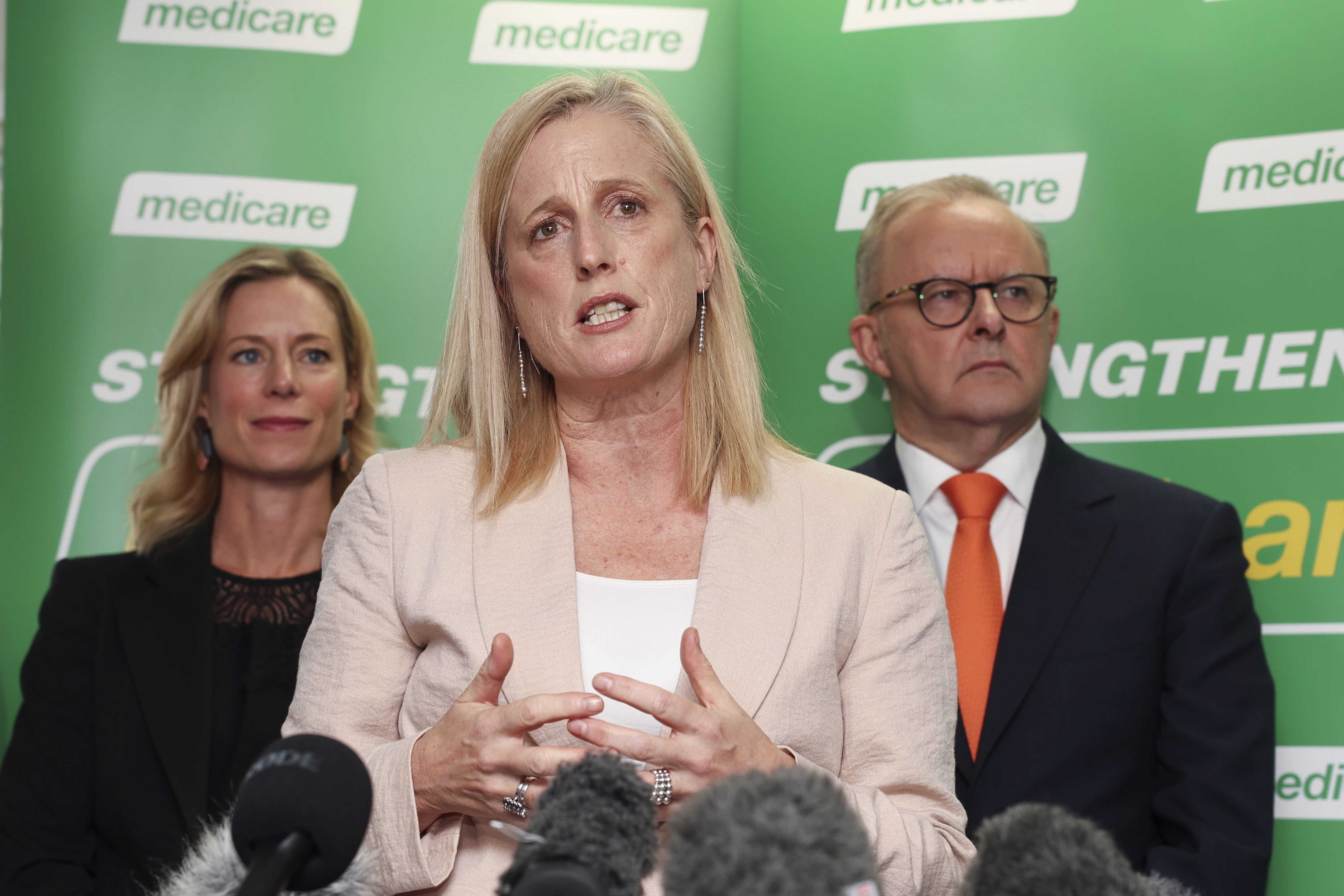 Labor candidate for Lyons Rebecca White, Minister for Finance, Minister for the Public Service, Minister for Women and Minister for Government Services Katy Gallagher and Prime Minister Anthony Albanese at a press conference during a visit to the Bridgewater urgent care clinic, in the electorate of Lyons, in Bridgewater, Tasmania, on Tuesday 15 April 2025 during the 2025 federal election campaign. fedpol Photo: Alex Ellinghausen