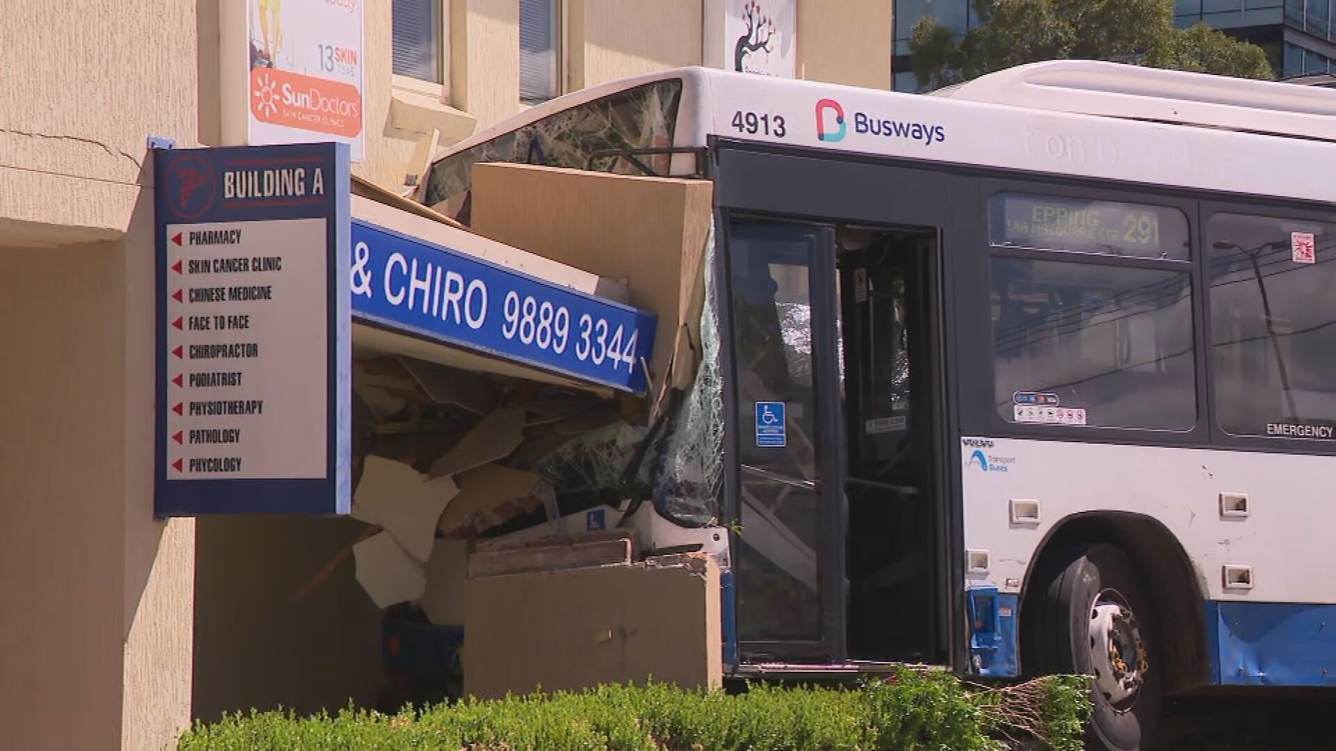 A bus has crashed into the side of a medical centre after a collision with a car in Sydney's north-west.