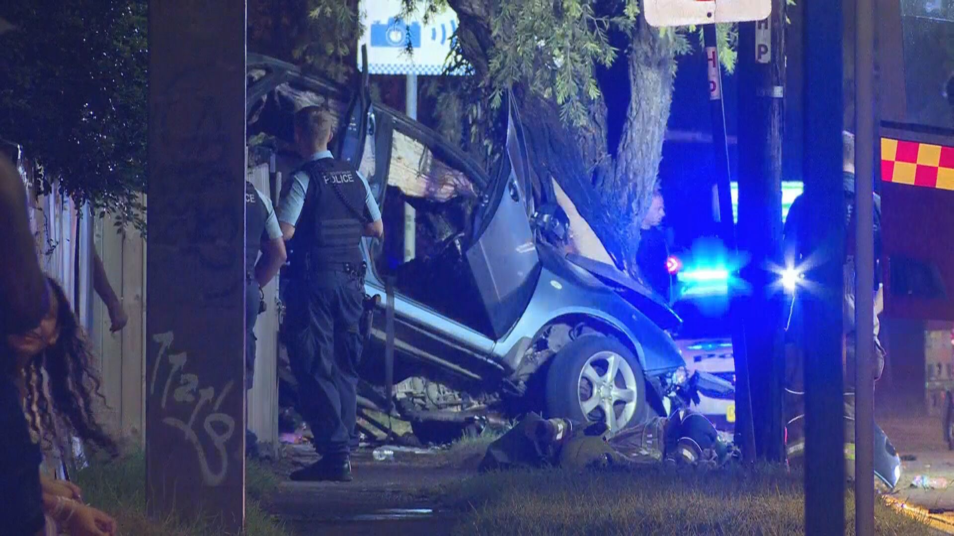 Police are investigating what caused the car to crash into the fence.