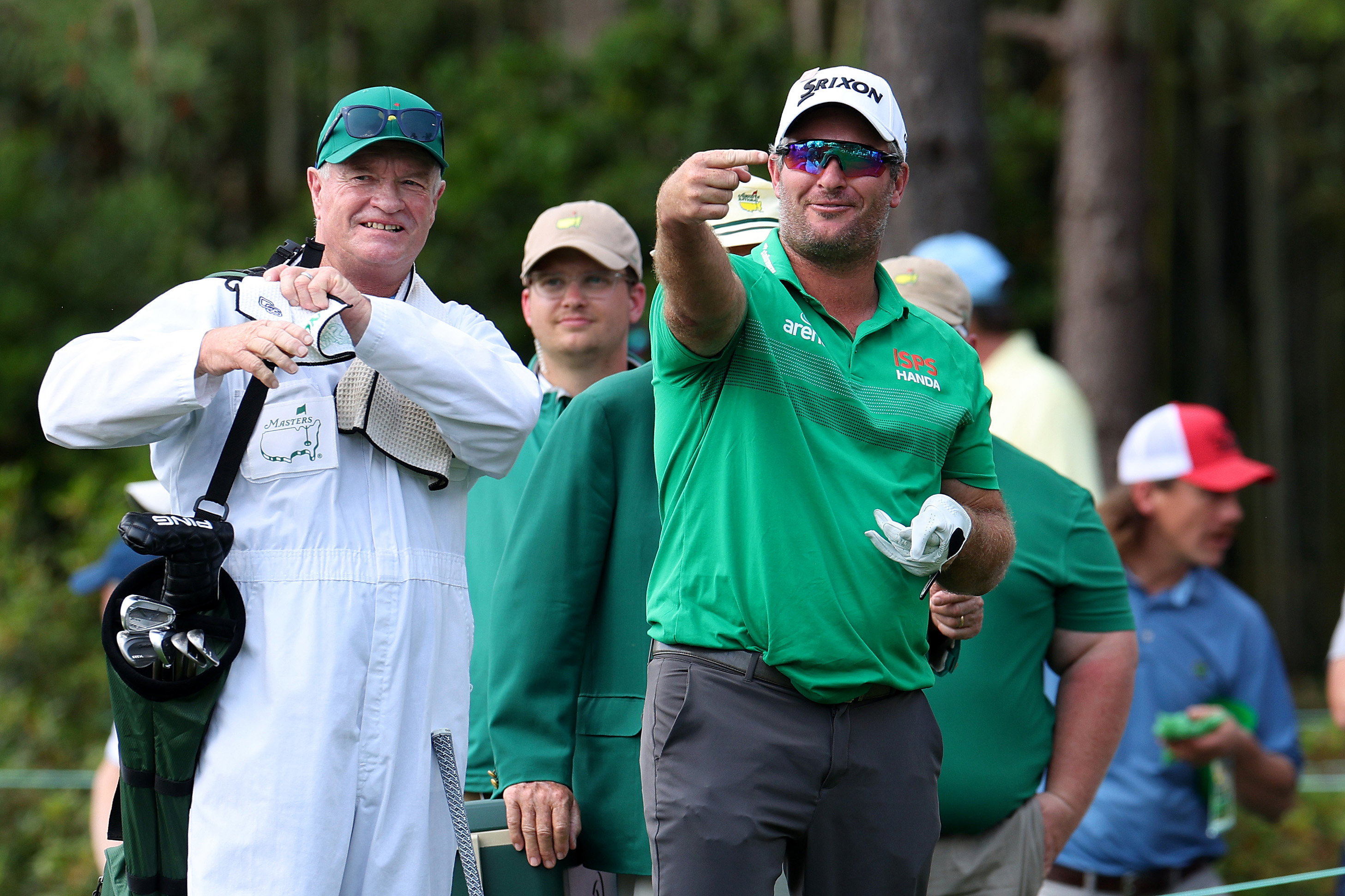 All Blacks legend Grant Fox caddies for son Ryan at Augusta National Golf Club.