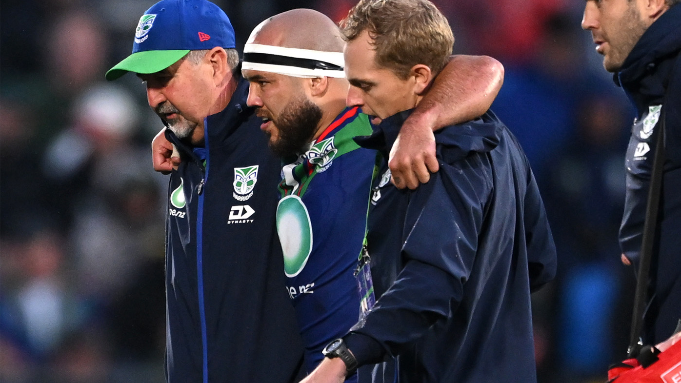 Jazz Tevaga is helped from the field during the round six NRL match between the Warriors and the Manly Sea Eagles.