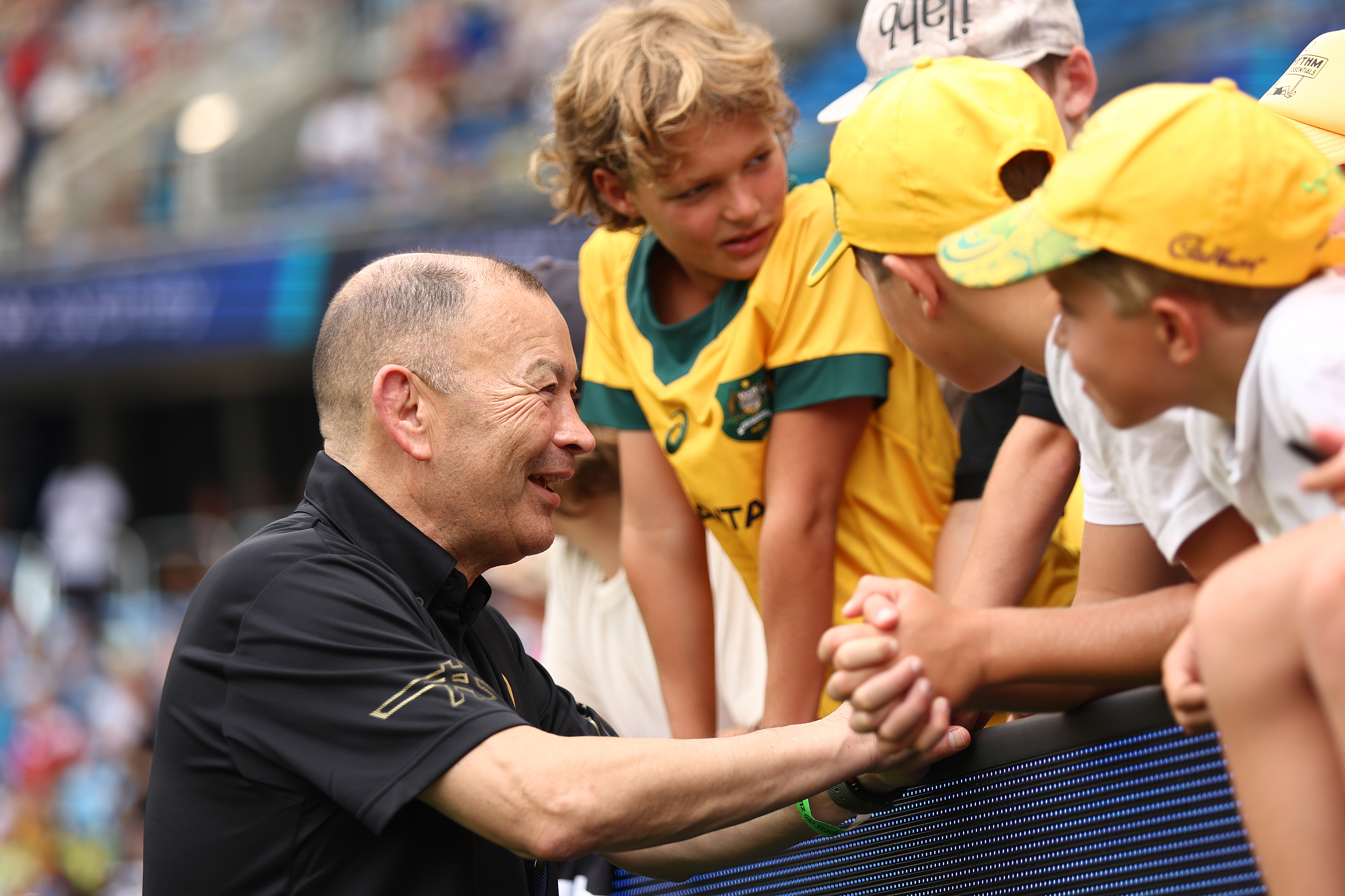 Wallabies coach Eddie Jones speaks to fans during the 2023 Sydney Sevens at Allianz Stadium.