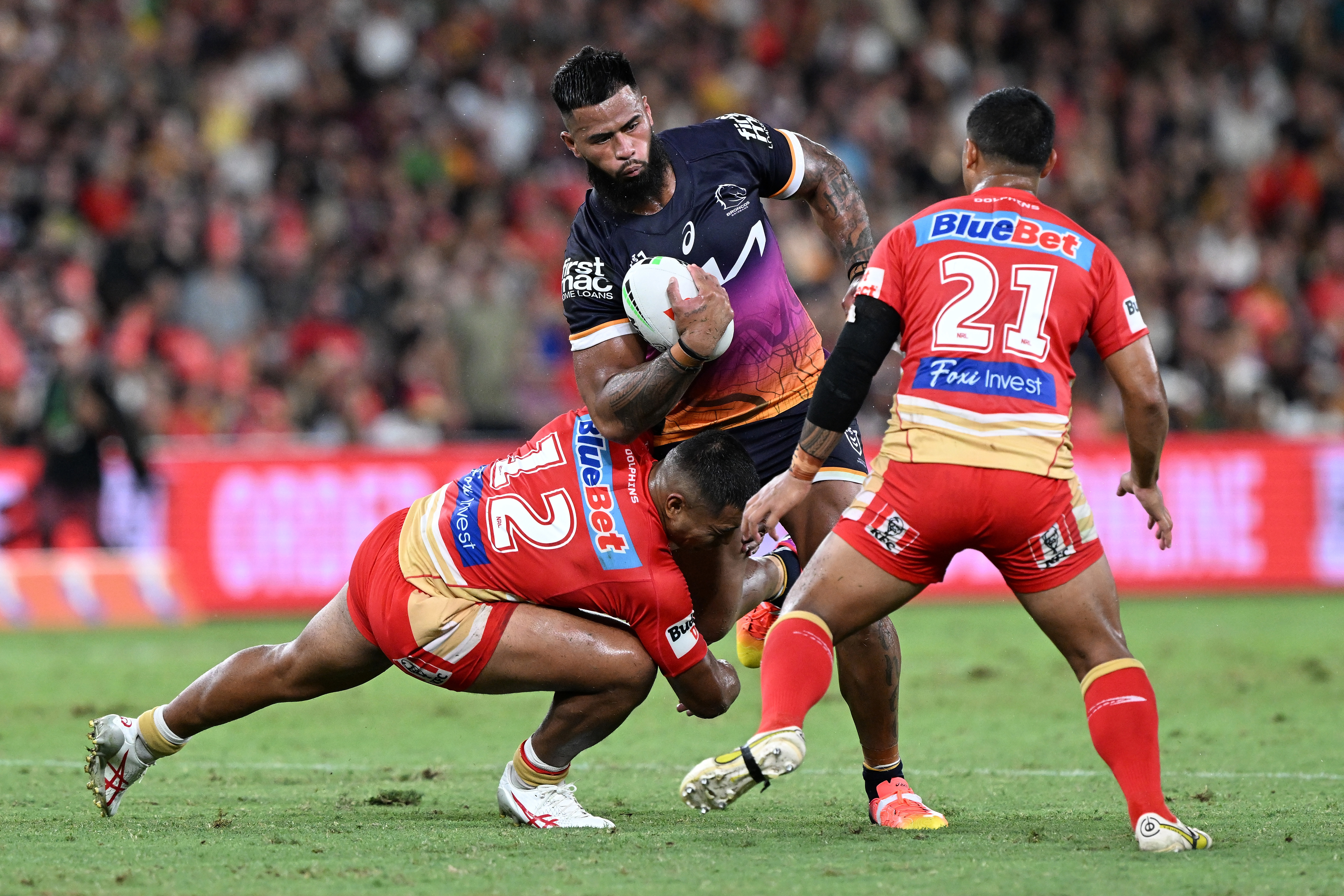 Payne Haas of the Broncos is tackled.