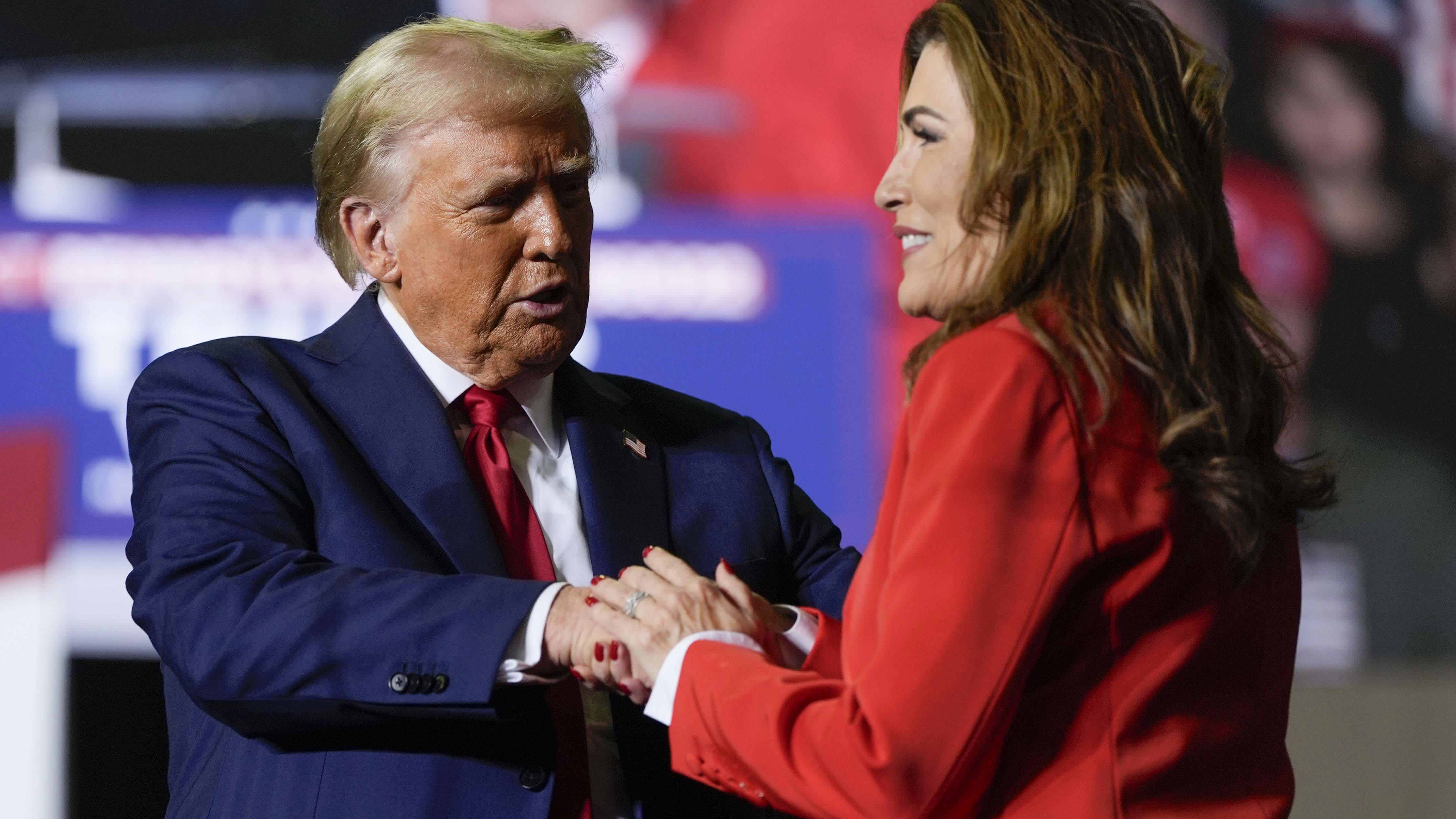 Republican presidential nominee former President Donald Trump greets Puerto Rico's shadow U.S. senator, Zoraida Buxo, at a campaign rally in Allentown, Pa., Tuesday, Oct. 29, 2024. (AP Photo/Julia Demaree Nikhinson)