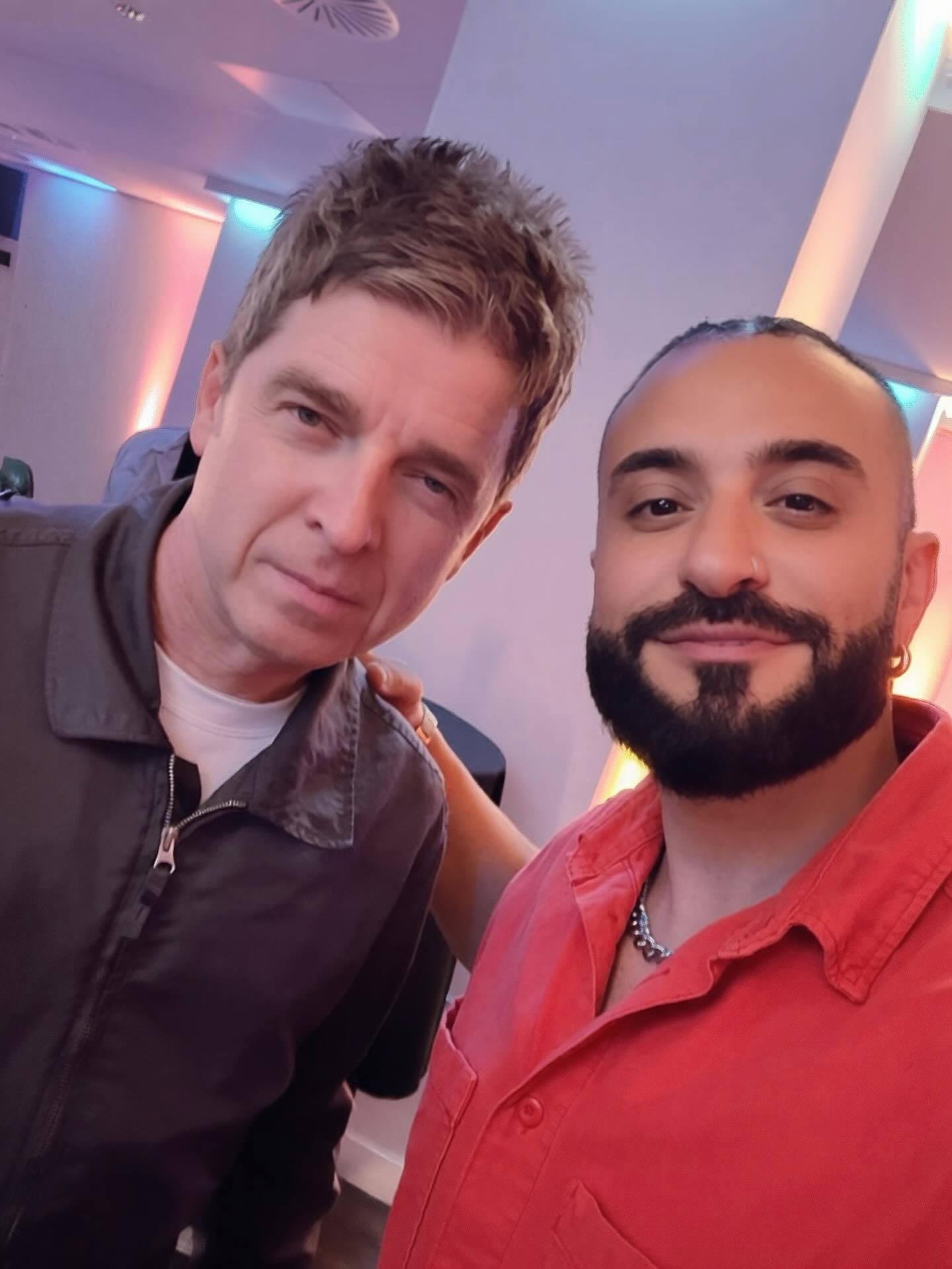 Kris Fade is pictured with Noel Gallagher of Oasis.