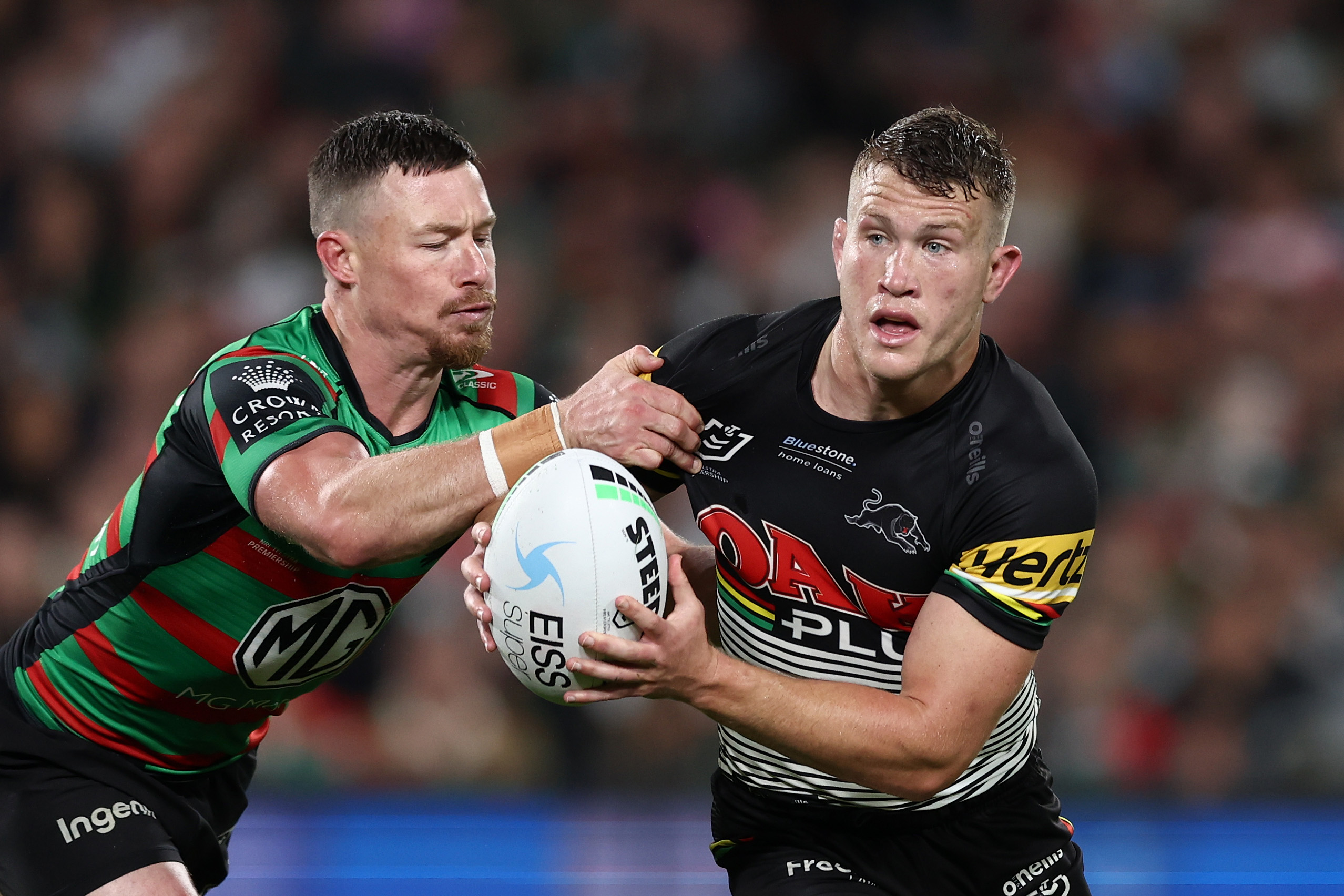 South Sydney's Damien Cook tackles Penrith hooker Mitch Kenny.