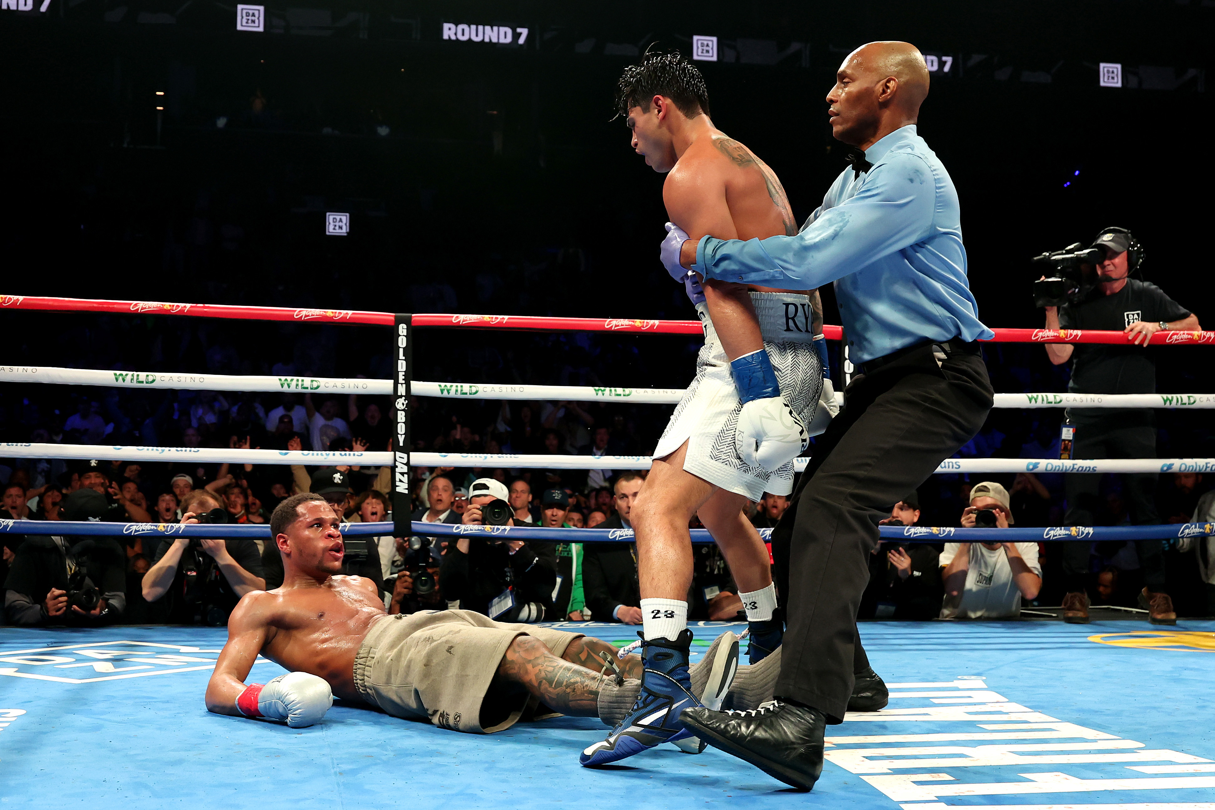 Ryan Garcia knocks down Devin Haney during their WBC Super Lightweight title bout.