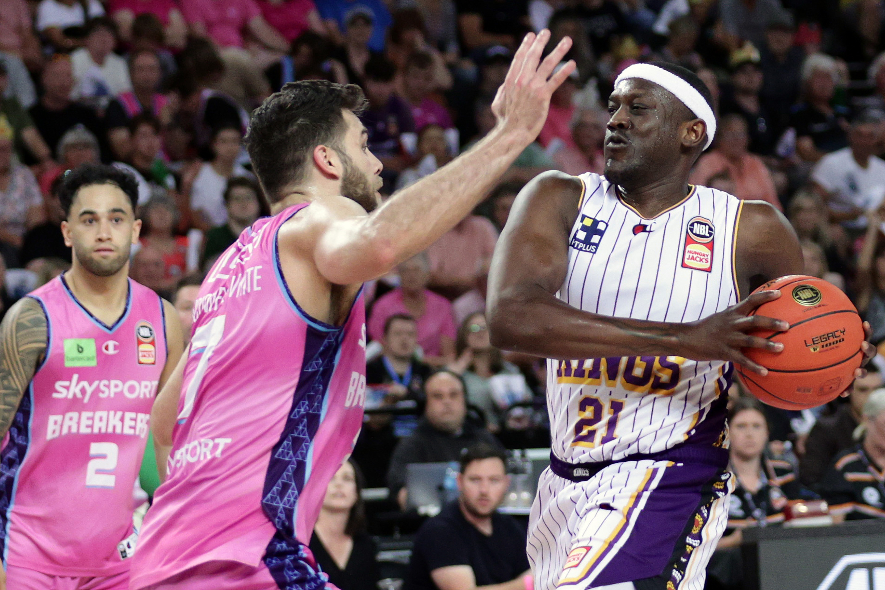 Kouat Noi of the Kings is challenged by the Breakers' Will McDowell-White.