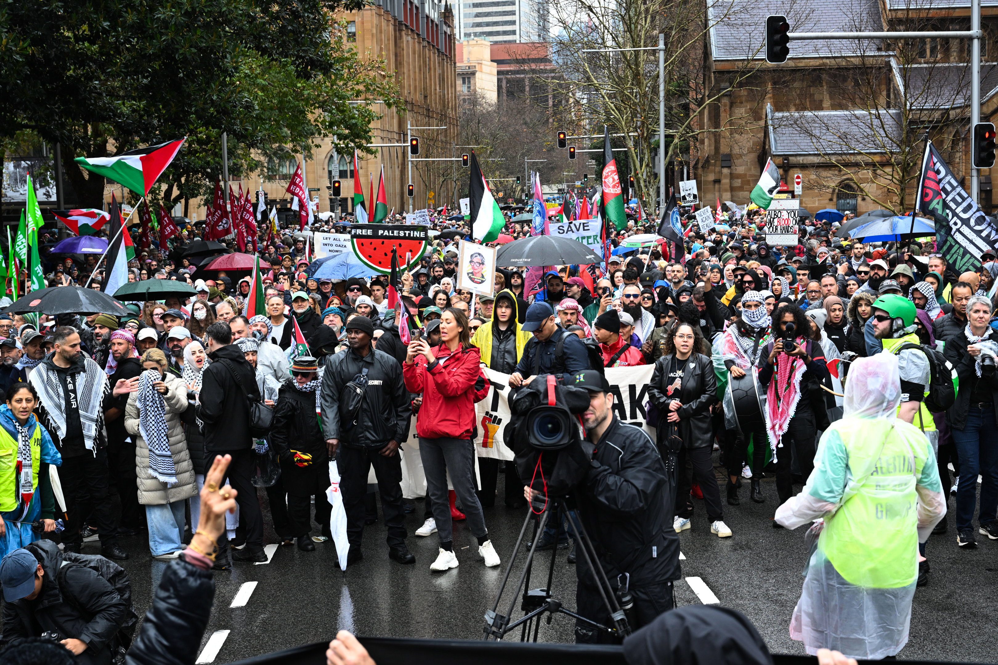 Pro-Palestine protesters chant outside the State Library of Victoria on August 03, 2025 in Melbourne, Australia. Protesters in Sydney and Melbourne joined marches and actions globally, as pressure mounts on the Israeli government over a devastating humanitarian crisis unfolding as its war against Hamas continues. (Photo by Asanka Ratnayake/Getty Images)