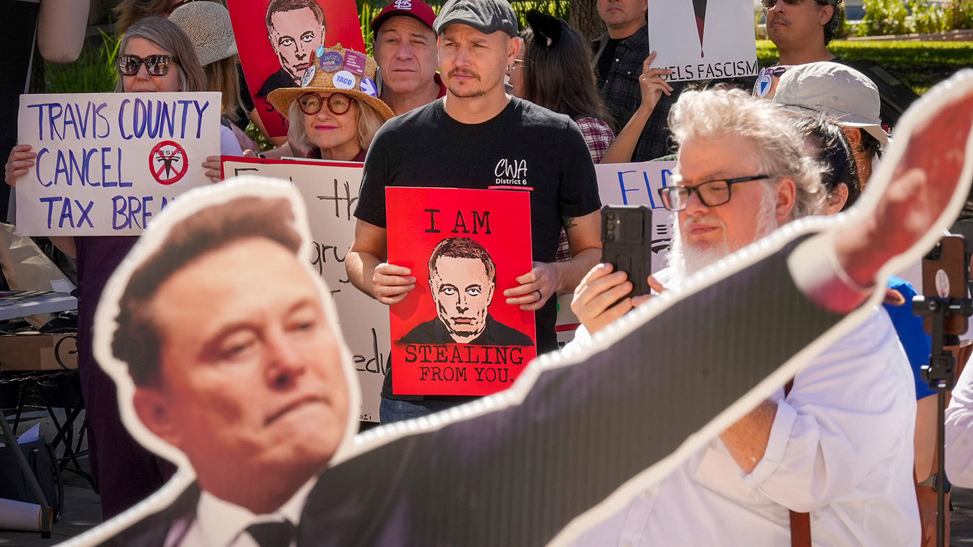 Demonstrators in Austin protest Elon Musk's pay deal.