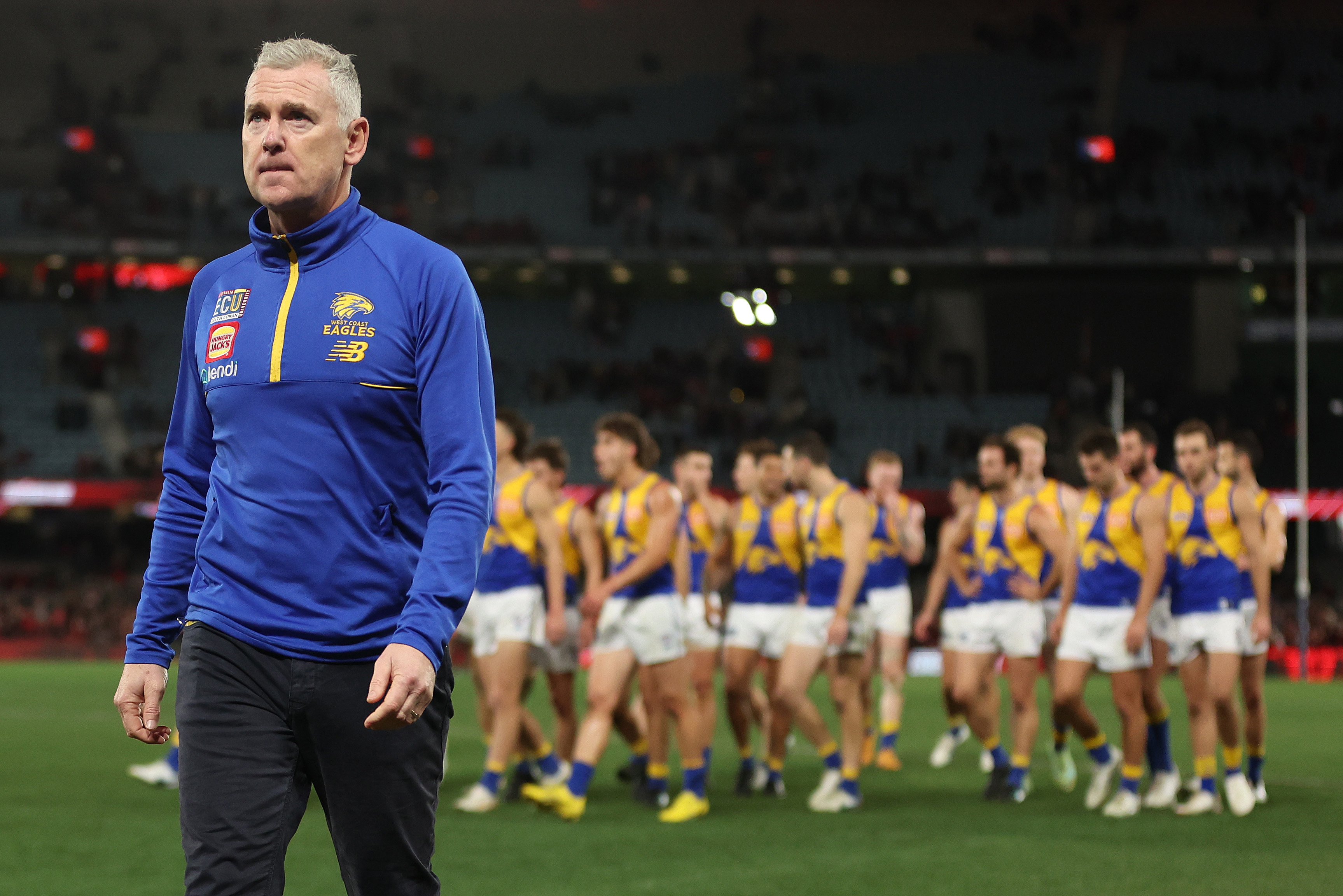 MELBOURNE, AUSTRALIA - AUGUST 05: Eagles coach Adam Simpson walks off after the Eagles were defeated by the Bombers during the round 21 AFL match between Essendon Bombers and West Coast Eagles at Marvel Stadium, on August 05, 2023, in Melbourne, Australia. (Photo by Robert Cianflone/Getty Images)