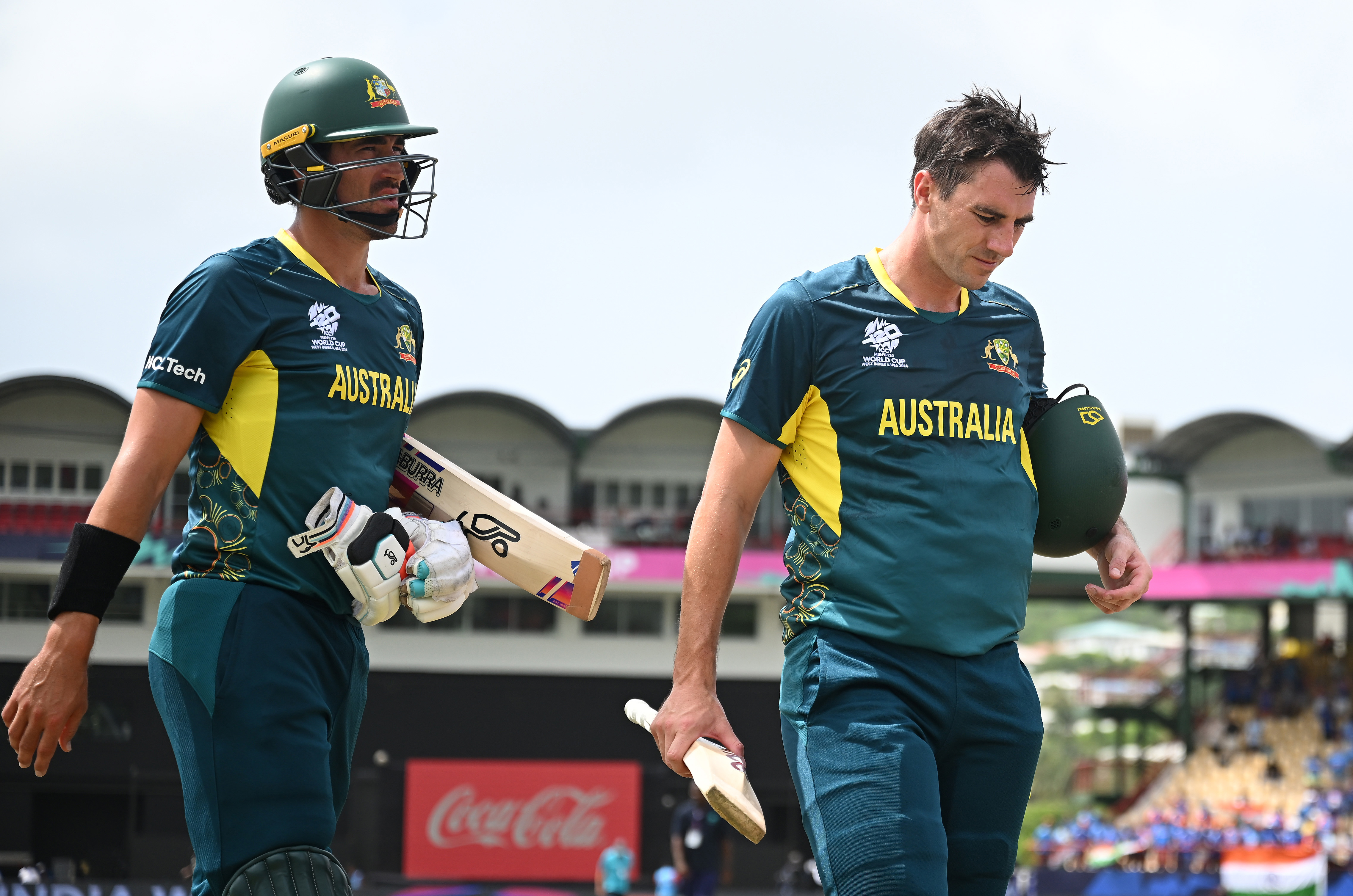 Pat Cummins and Mitchell Starc of Australia cut dejected figures following the loss to India.