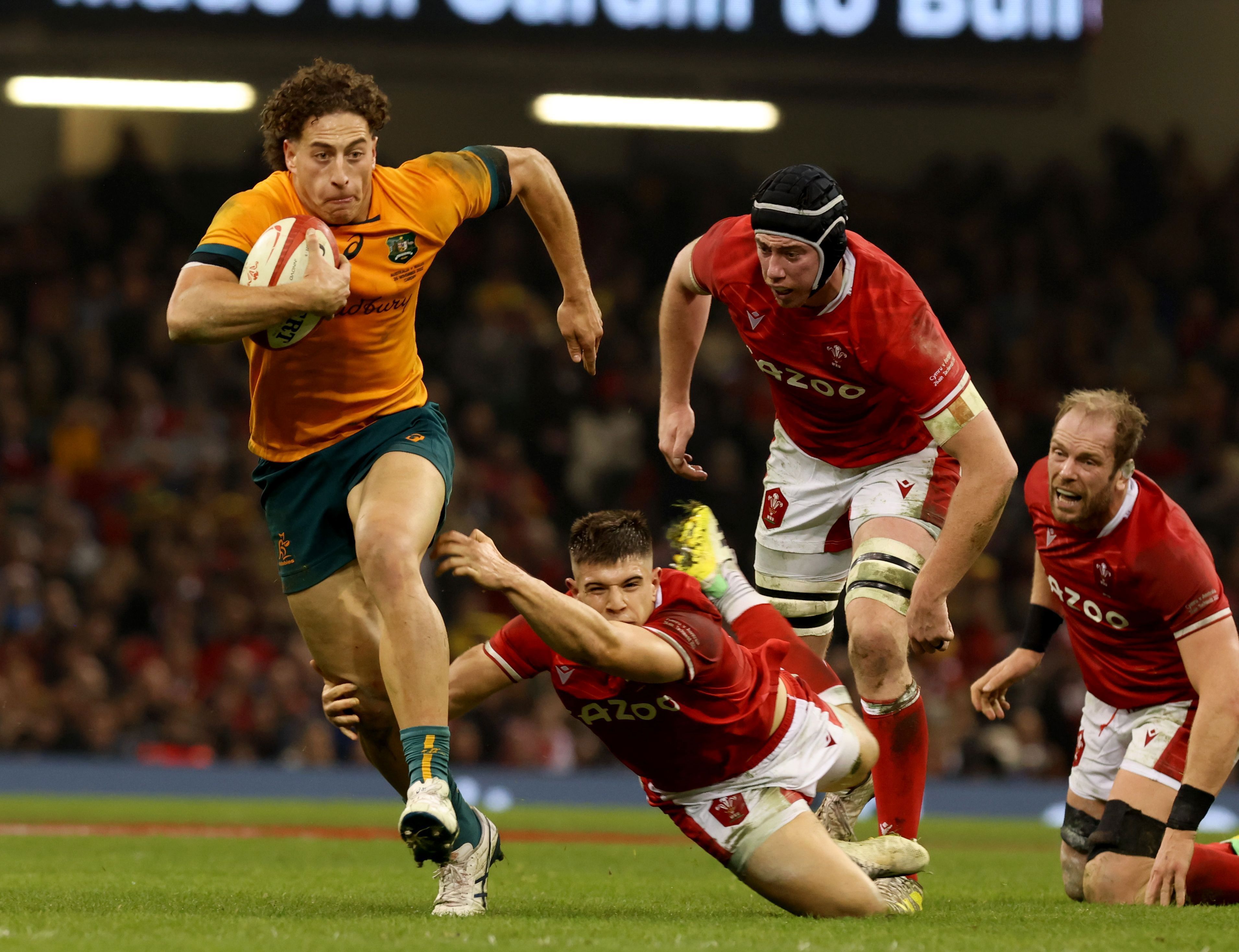 Mark Nawaqanitawase runs the ball for Australia against Wales.