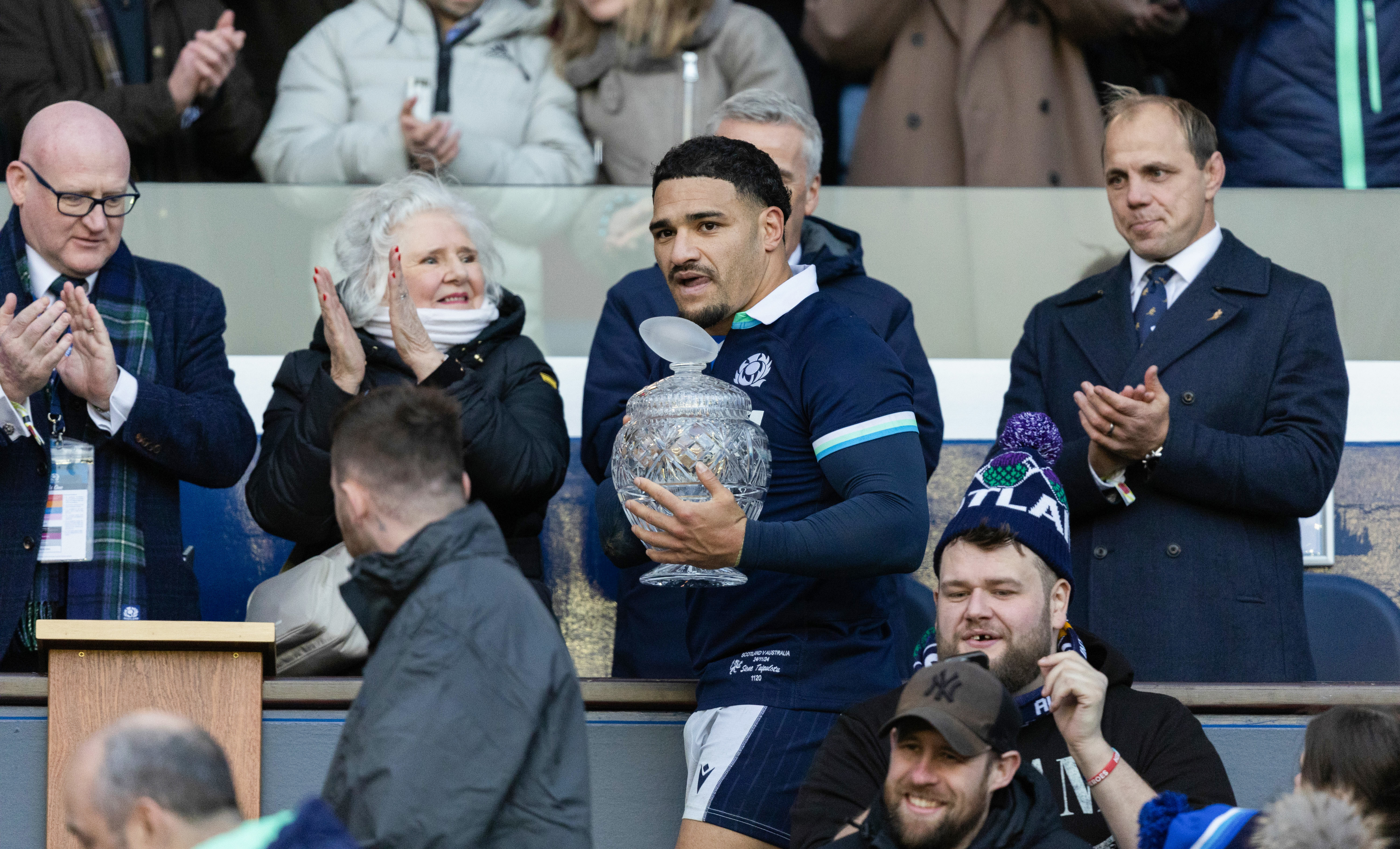 Scotland's Sione Tuipulotu with his gran Jaqueline Thomson as Phil Waugh watches on.