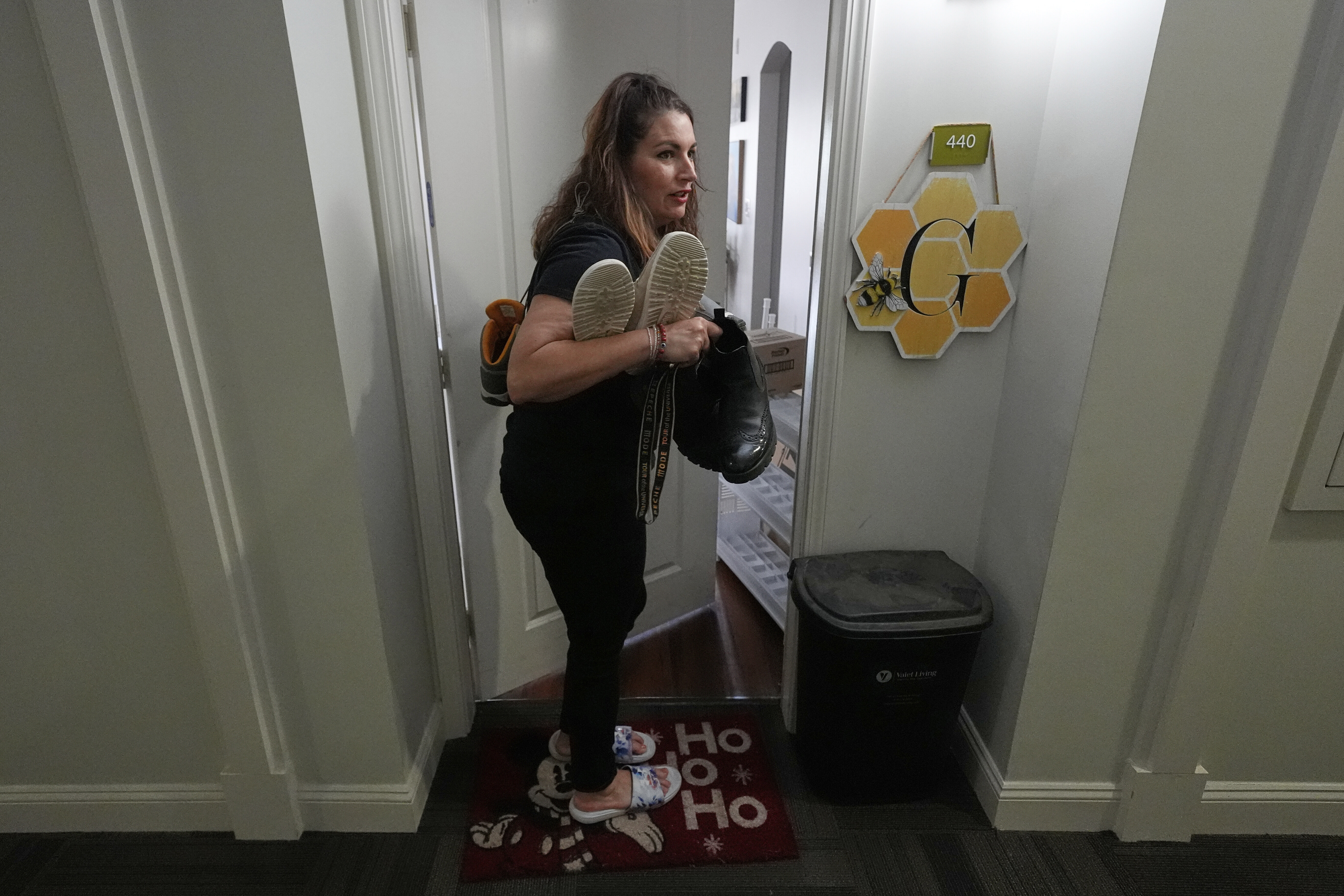 Shea Giagnorio packs belongings in her apartment days after getting fired from her job with the Administration for Children and Families, Monday, April 14, 2025, in Overland Park, Kan. (AP Photo/Charlie Riedel)
