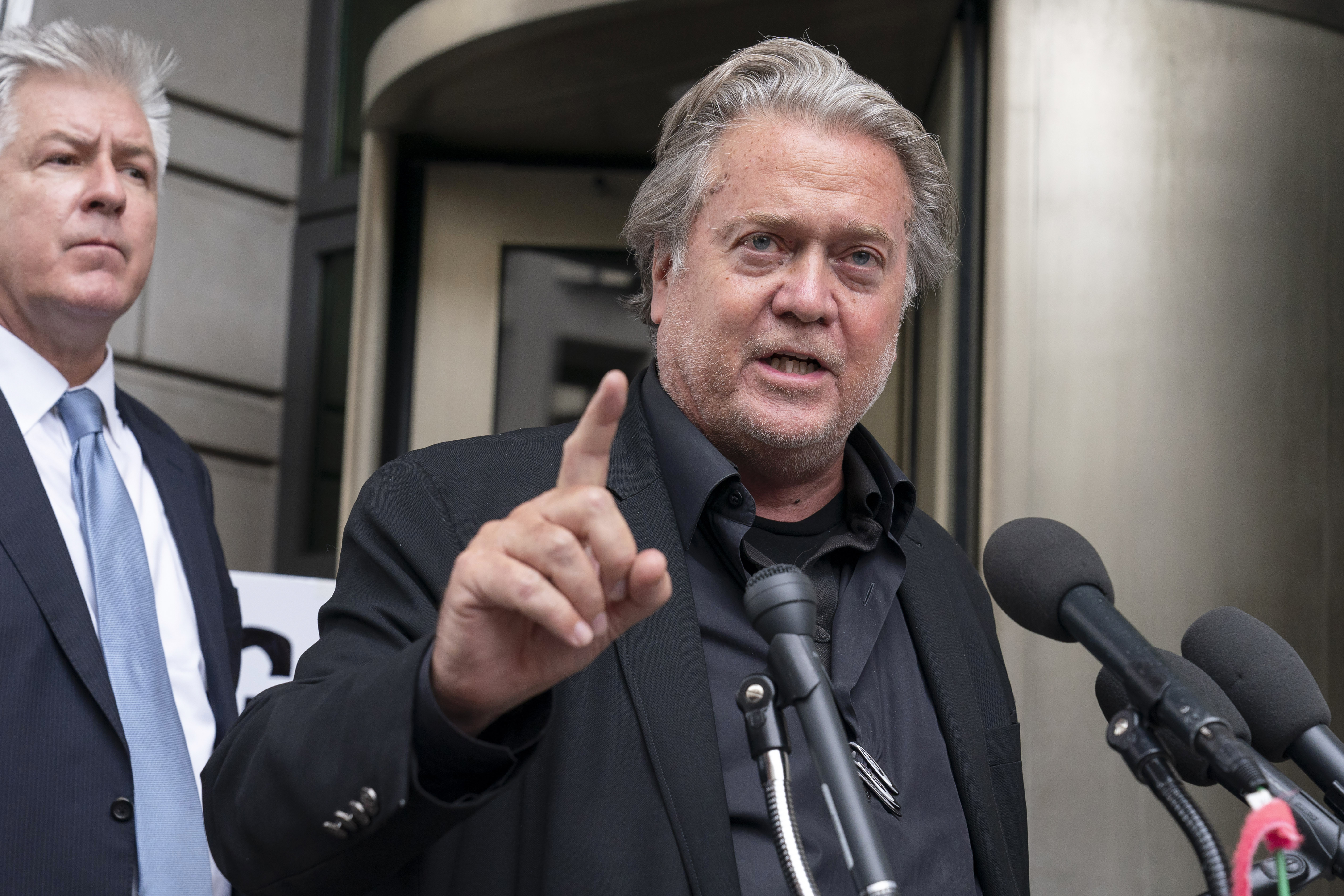 Steve Bannon speaks to the media as he departs the federal court in Washington, Thursday, July 21, 2022. Bannon was brought to trial on a pair of federal charges for criminal contempt of Congress after refusing to cooperate with the House committee investigating the U.S. Capitol insurrection on Jan. 6, 2021. (AP Photo/Jose Luis Magana)