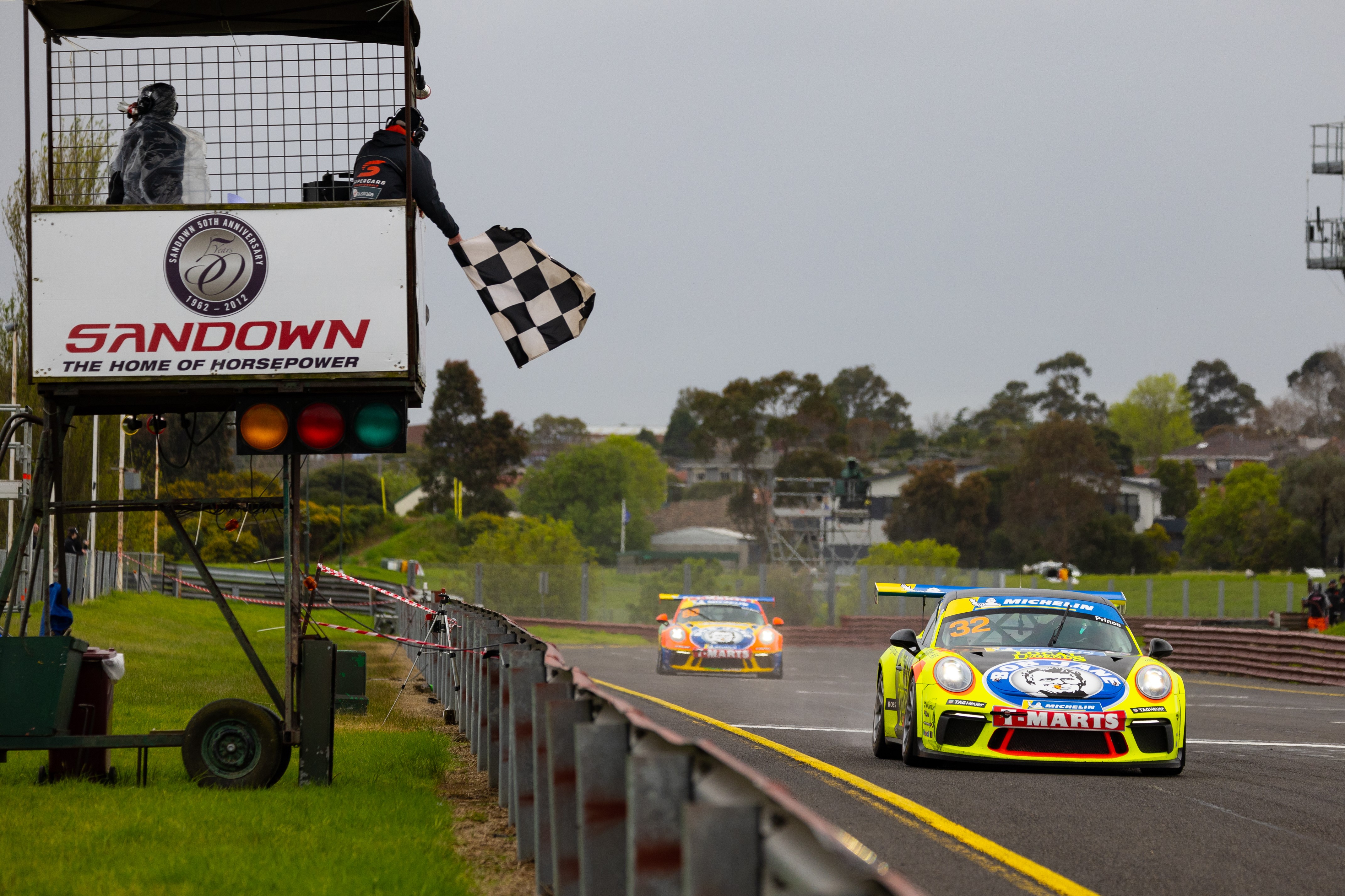 Courtney Prince takes the chequered flag on her way to third at Sandown.