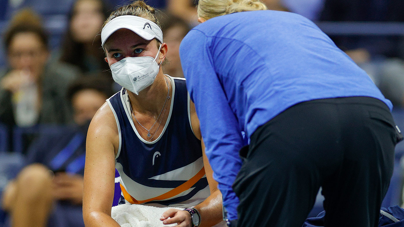 Barbora Krejcikova of Czech Republic talks with her trainer during her Women's Singles fourth round match against Garbine Muguruza of Spain on Day Seven at the USTA Billie Jean King National Tennis Center on September 05, 2021 in New York City. (Photo by Sarah Stier/Getty Images)