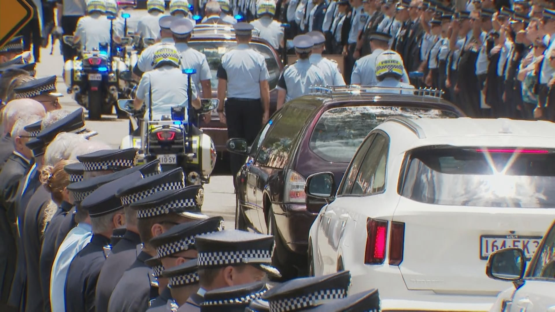 Guard of honour through Brisbane streets for Queensland police officers Constables Rachel McCrow and Matthew Arnold.