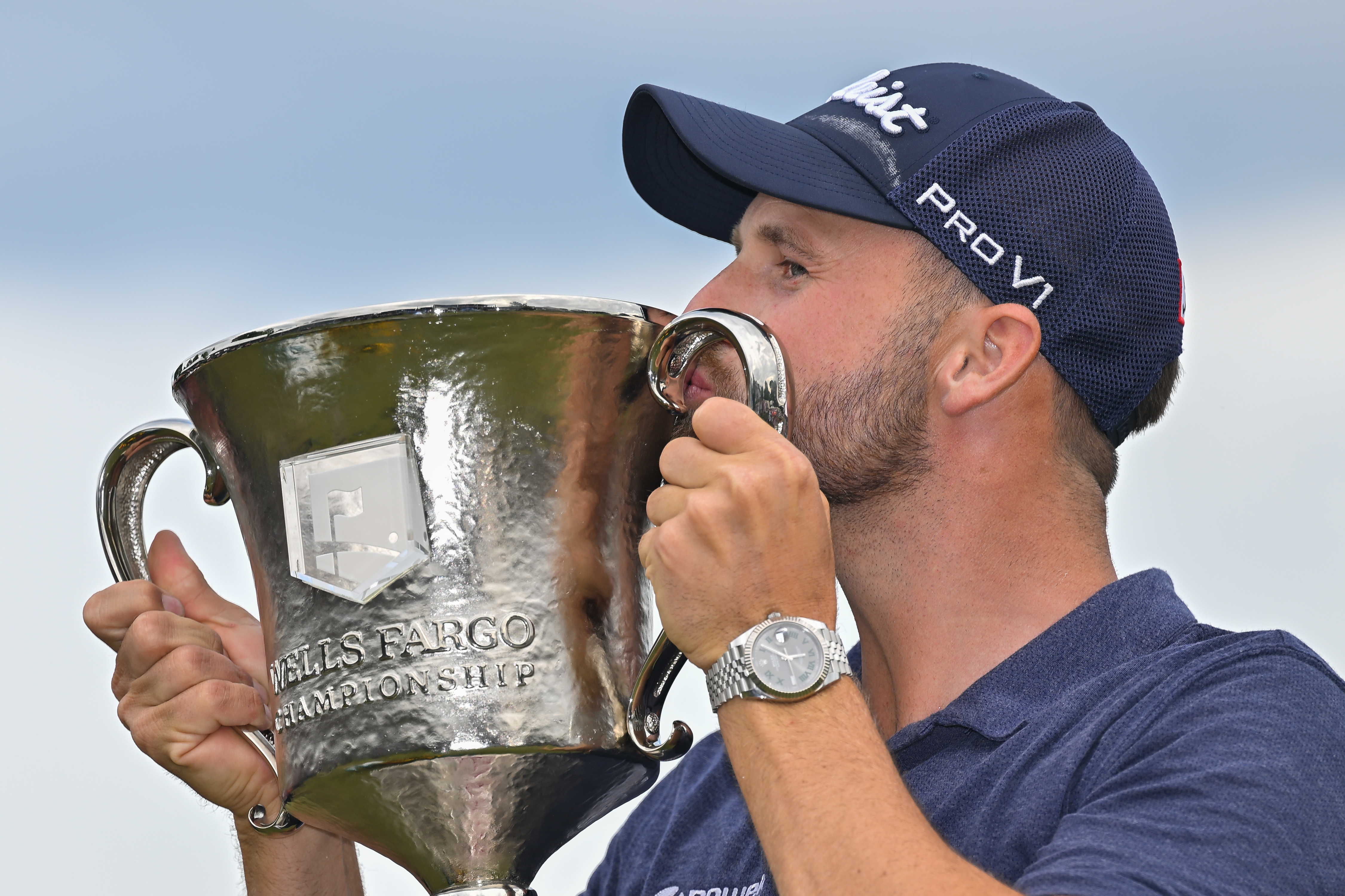 Wyndham Clark kisses the trophy on the 18th green after the final round of the Wells Fargo Championship at Quail Hollow Club on May 7, 2023 in Charlotte, North Carolina. (Photo by Ben Jared/PGA TOUR via Getty Images)