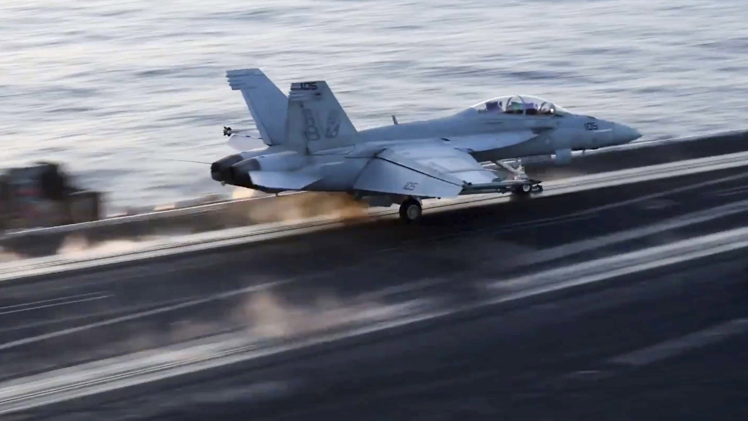 This image taken from video provided by the US Navy shows an aircraft launching from the USS Harry S. Truman in the Red Sea before airstrikes in Sanaa, Yemen,