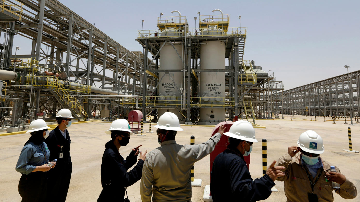Saudi Aramco engineers look at the Hawiyah Natural Gas Liquids Recovery Plant in Hawiyah, in the Eastern Province of Saudi Arabia