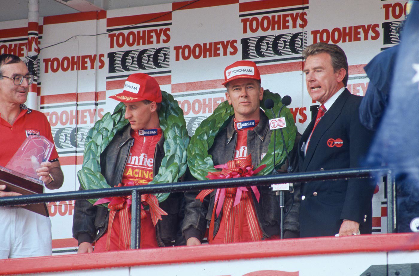 Mark Skaife (second left) and Jim Richards (second right) wear their winners' wreaths. 