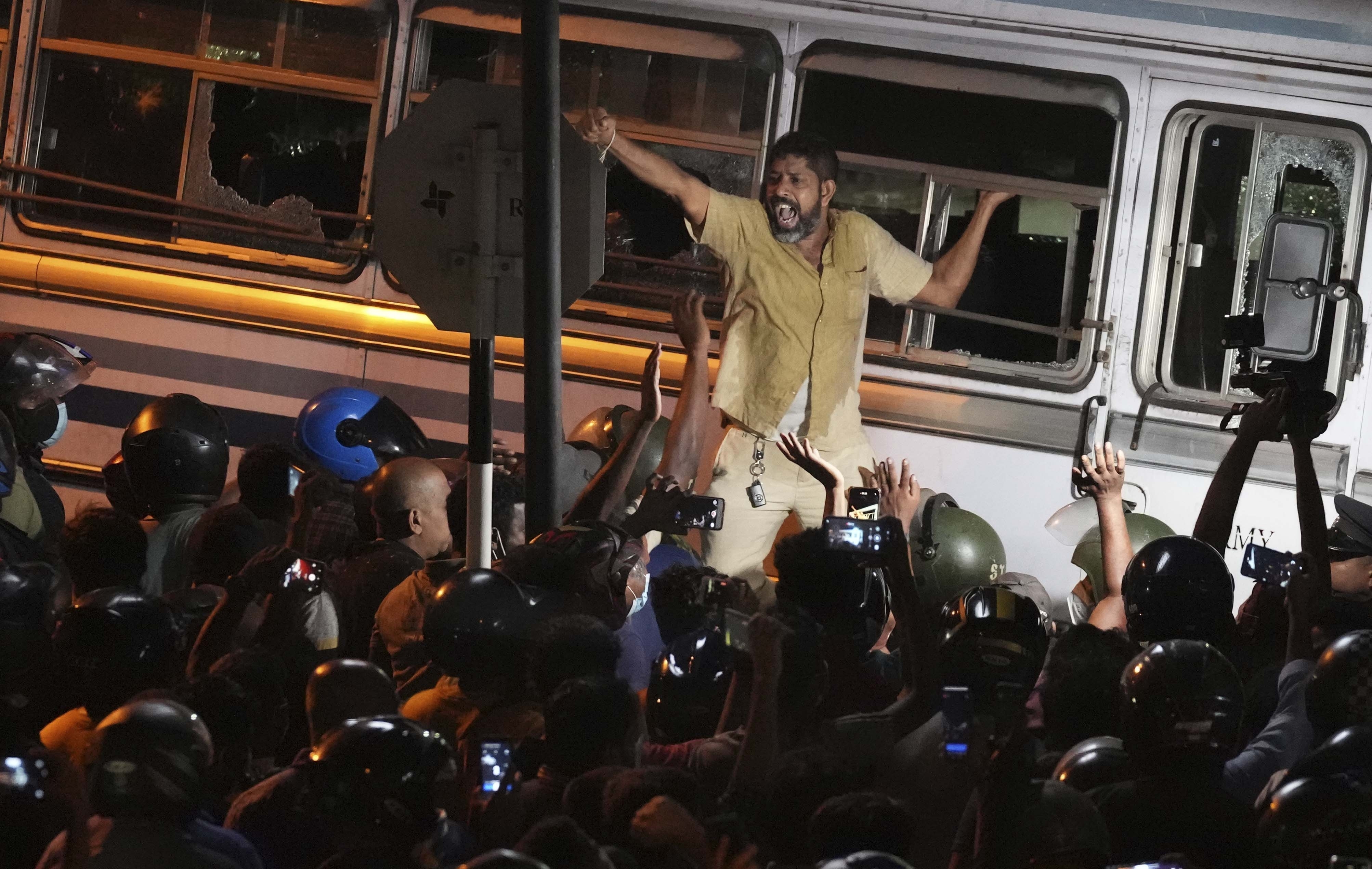 A Sri Lankan shouts anti government slogans during a protest outside Sri Lanka's President's private residence on the outskirts of Colombo. 