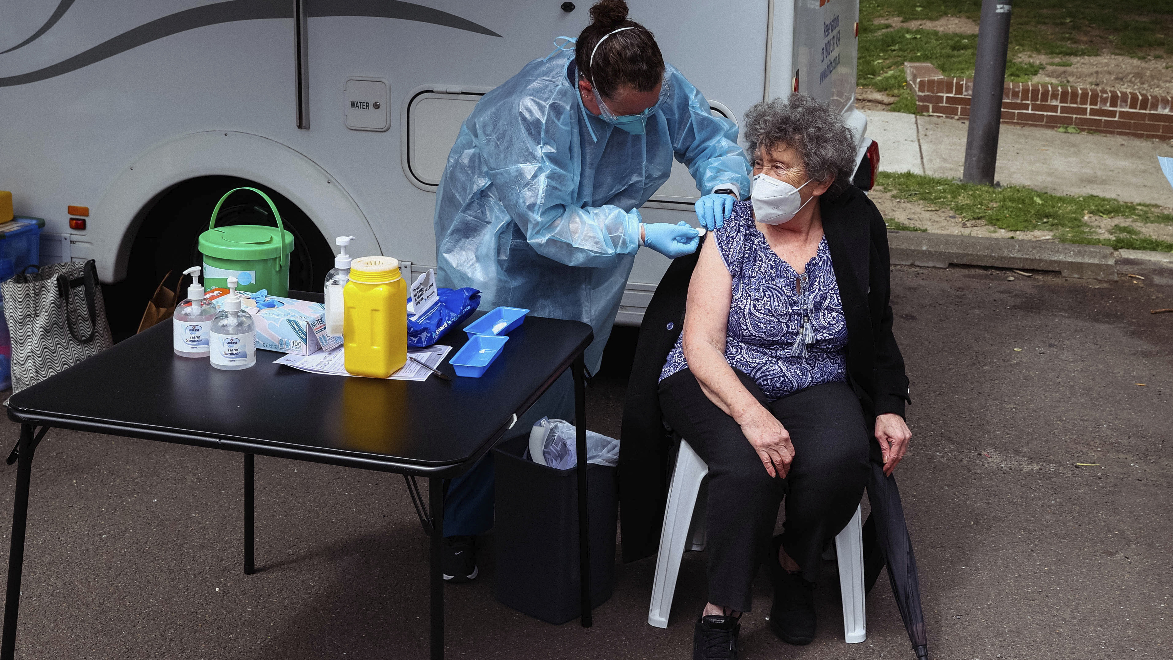 Raisa Myndra receives a Pfizer vaccine dose at a pop up vaccination hub at the Waterloo Public Housing Estate in Sydney.