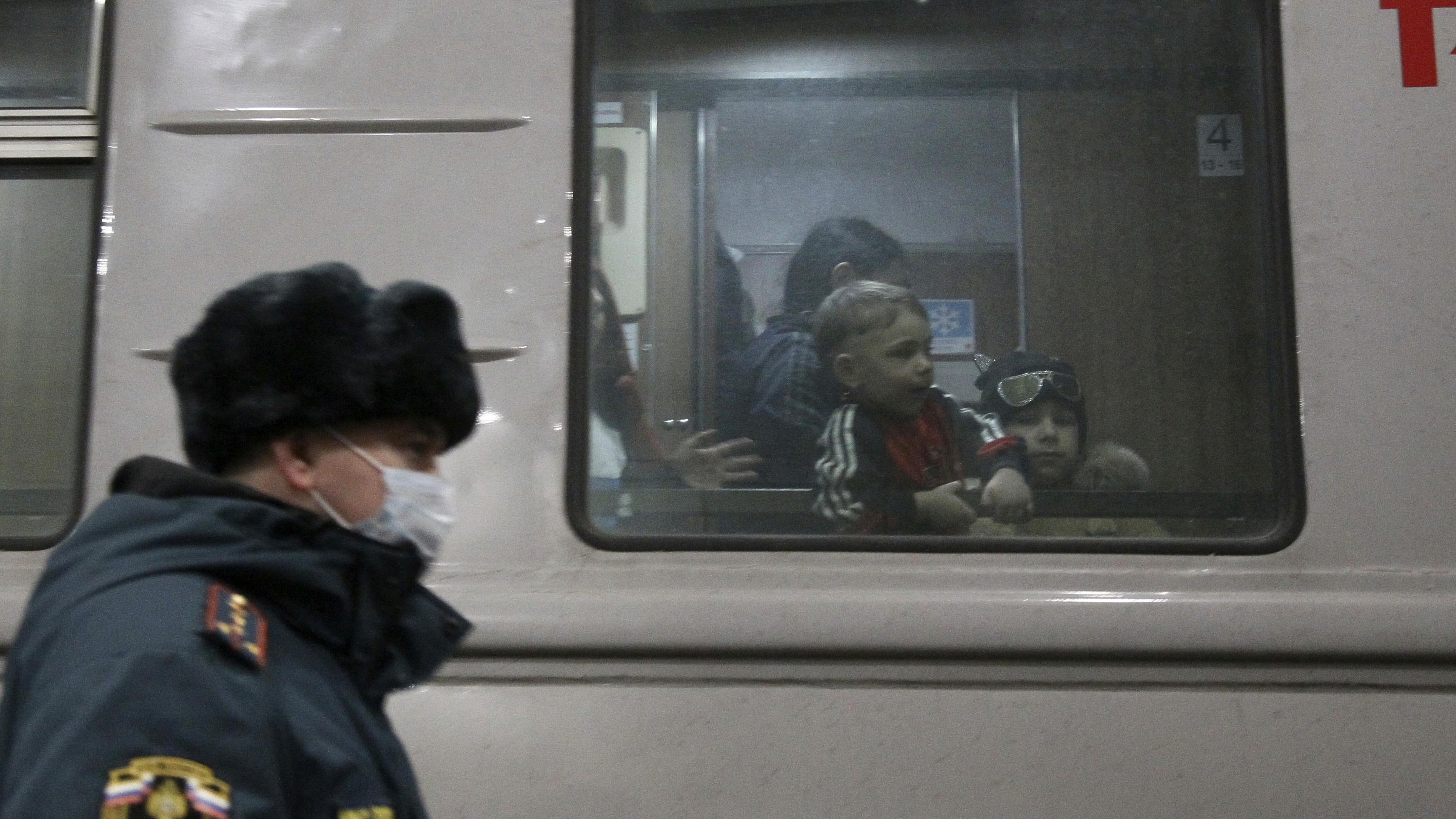 Children evacuated from the Donetsk region, the territory controlled by a pro-Russia separatist governments in eastern Ukraine, are seen through a train window as they wait to be taken to temporary housing, at the railway station in Nizhny Novgorod, Russia.
