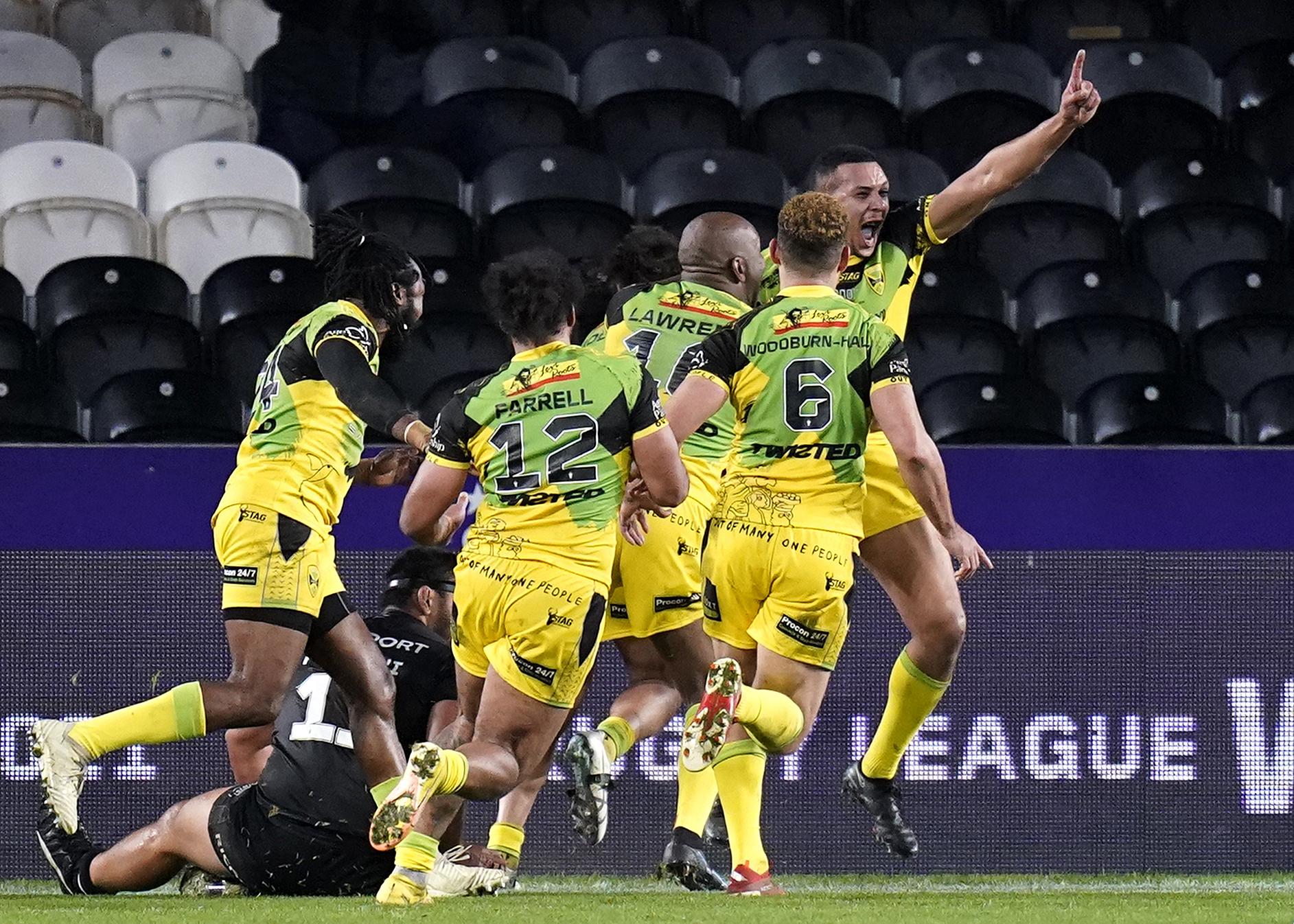 Jamaica's Ben Jones-Bishop (right) celebrates with team-mates after scoring their side's first try during the Rugby League World Cup group C match at the MKM Stadium, Kingston upon Hull. Picture date: Saturday October 22, 2022. (Photo by Danny Lawson/PA Images via Getty Images)