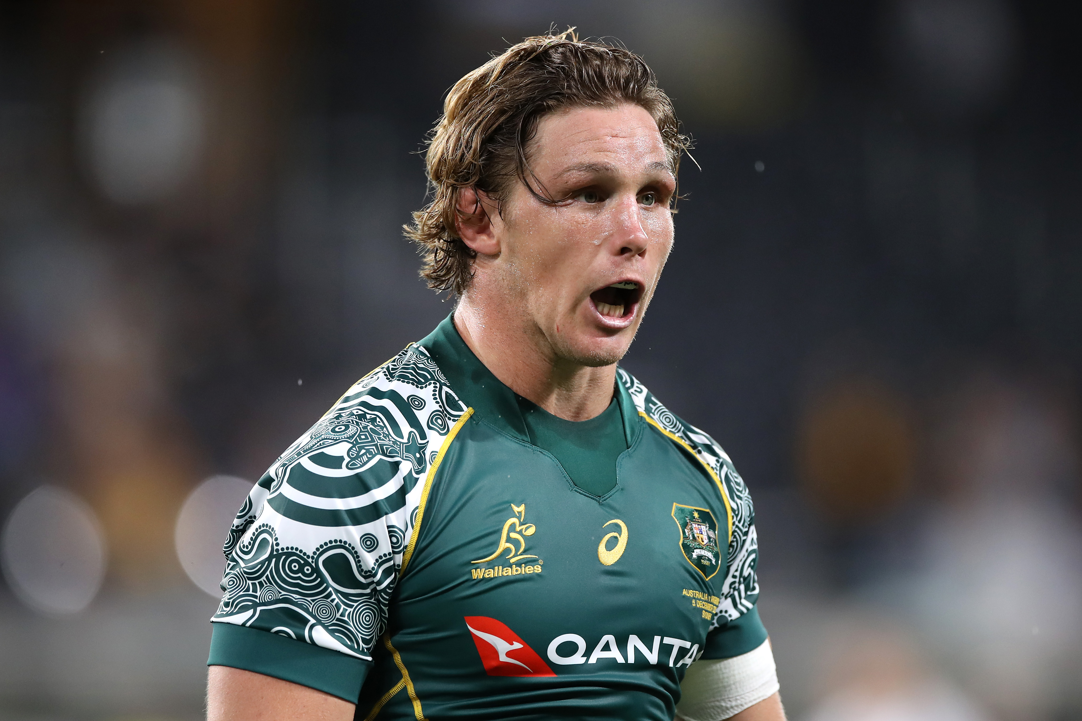 Michael Hooper of the Wallabies looks on.