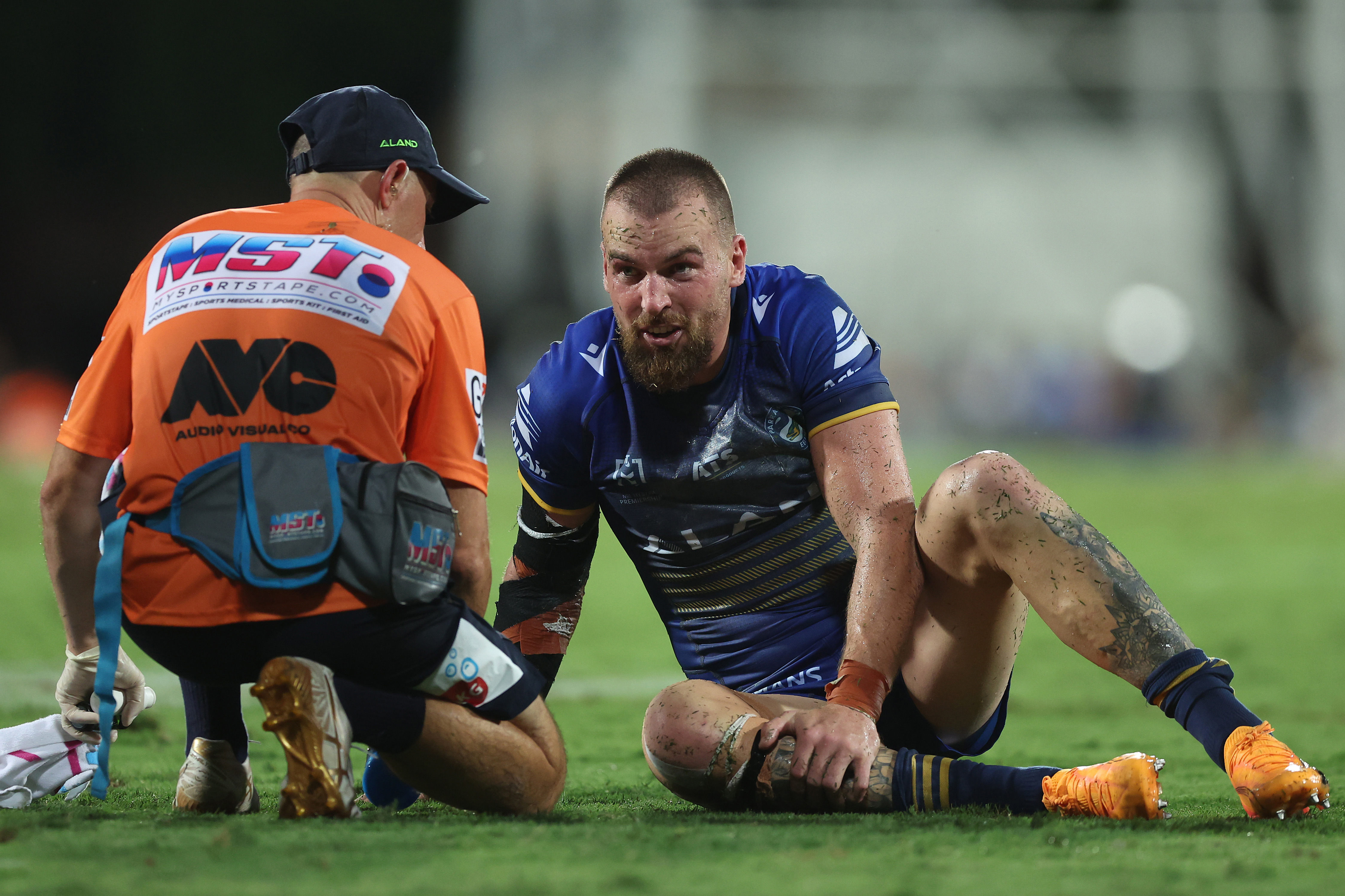 Clint Gutherson attended to by a trainer after an injury during the round seven NRL match between Parramatta Eels and Dolphins. 