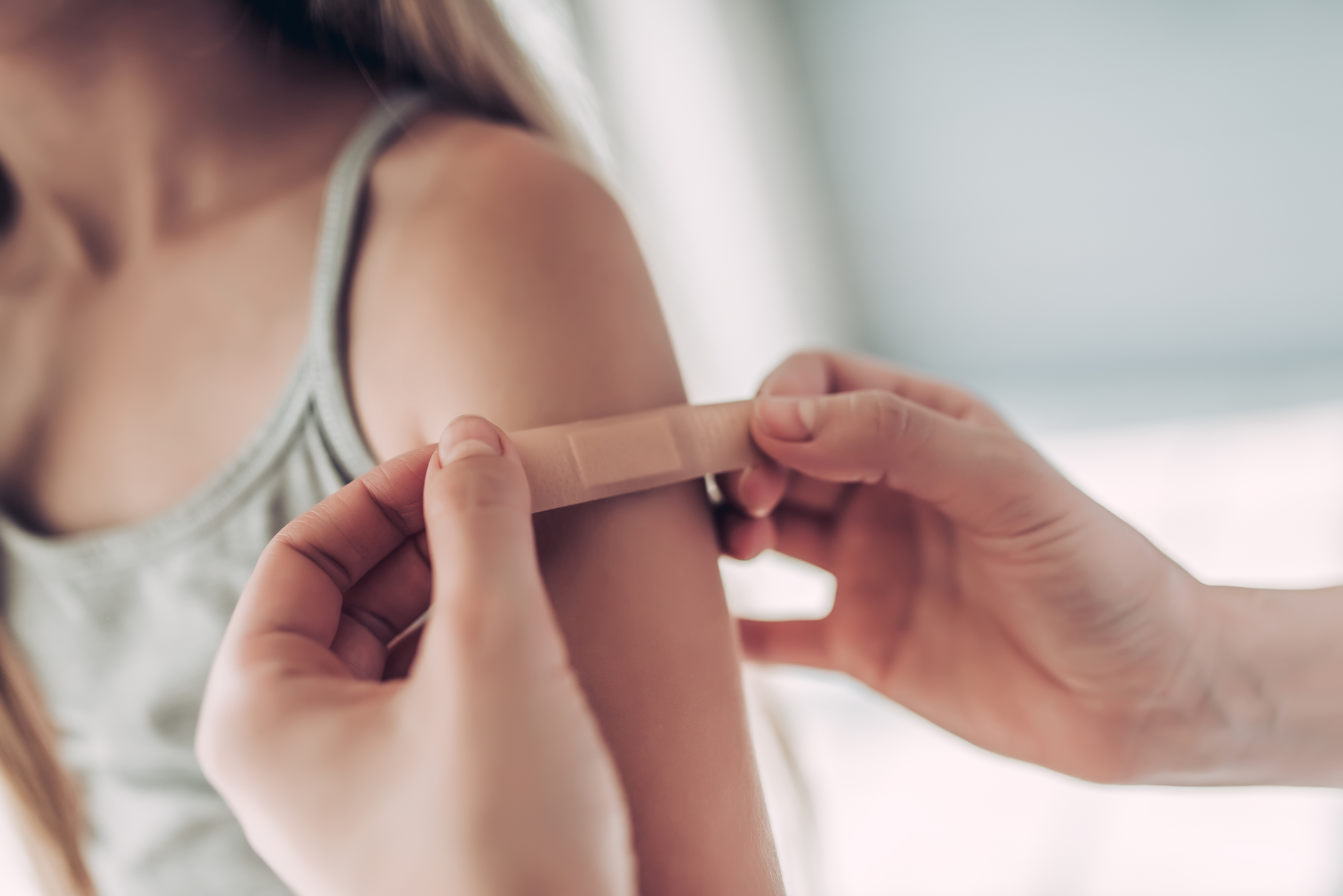 Child arm vaccine band-aid