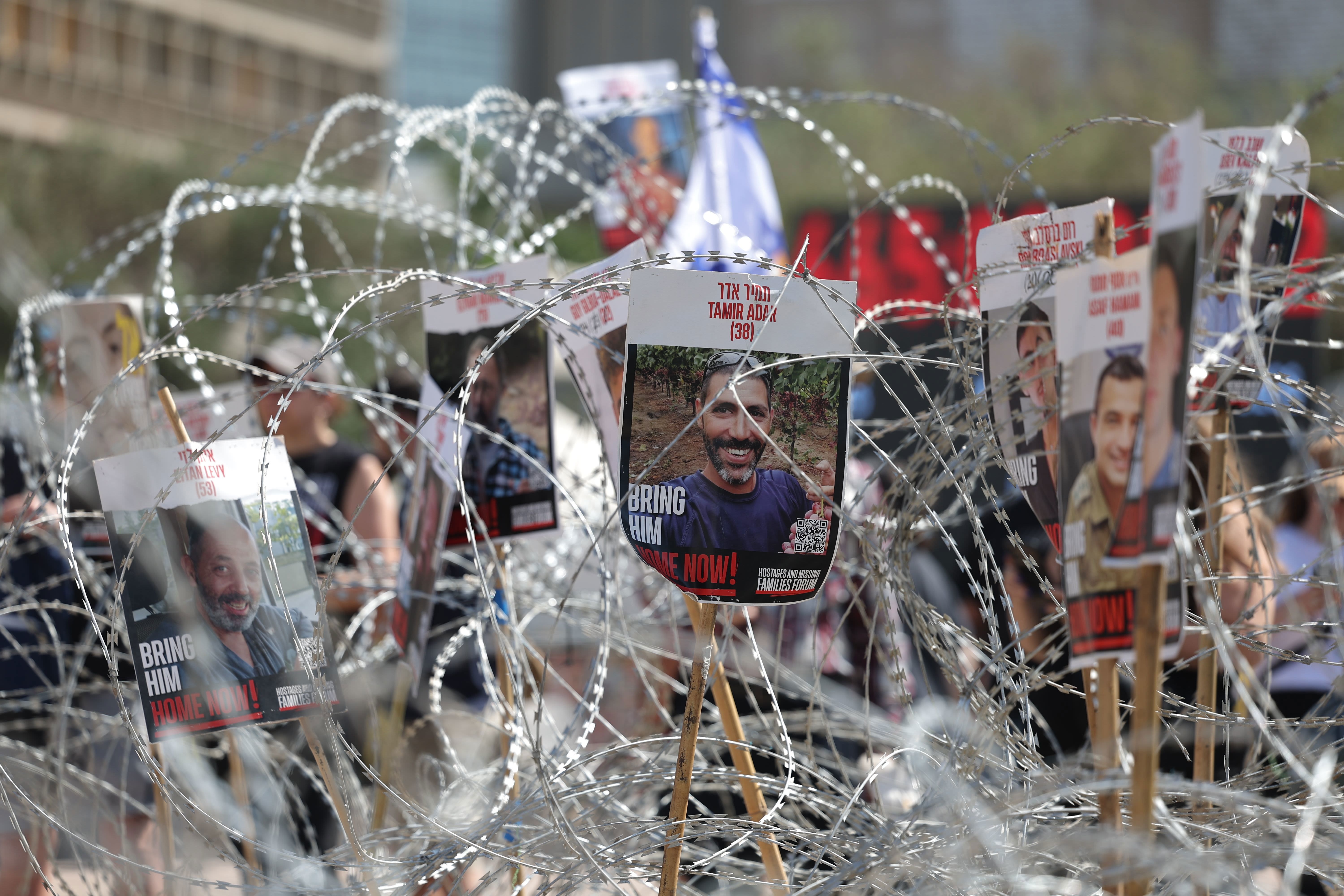 Pictures of Israeli hostages held in Gaza during a demonstration outside the Kirya military headquarters in Tel Aviv, Israel, on August 2