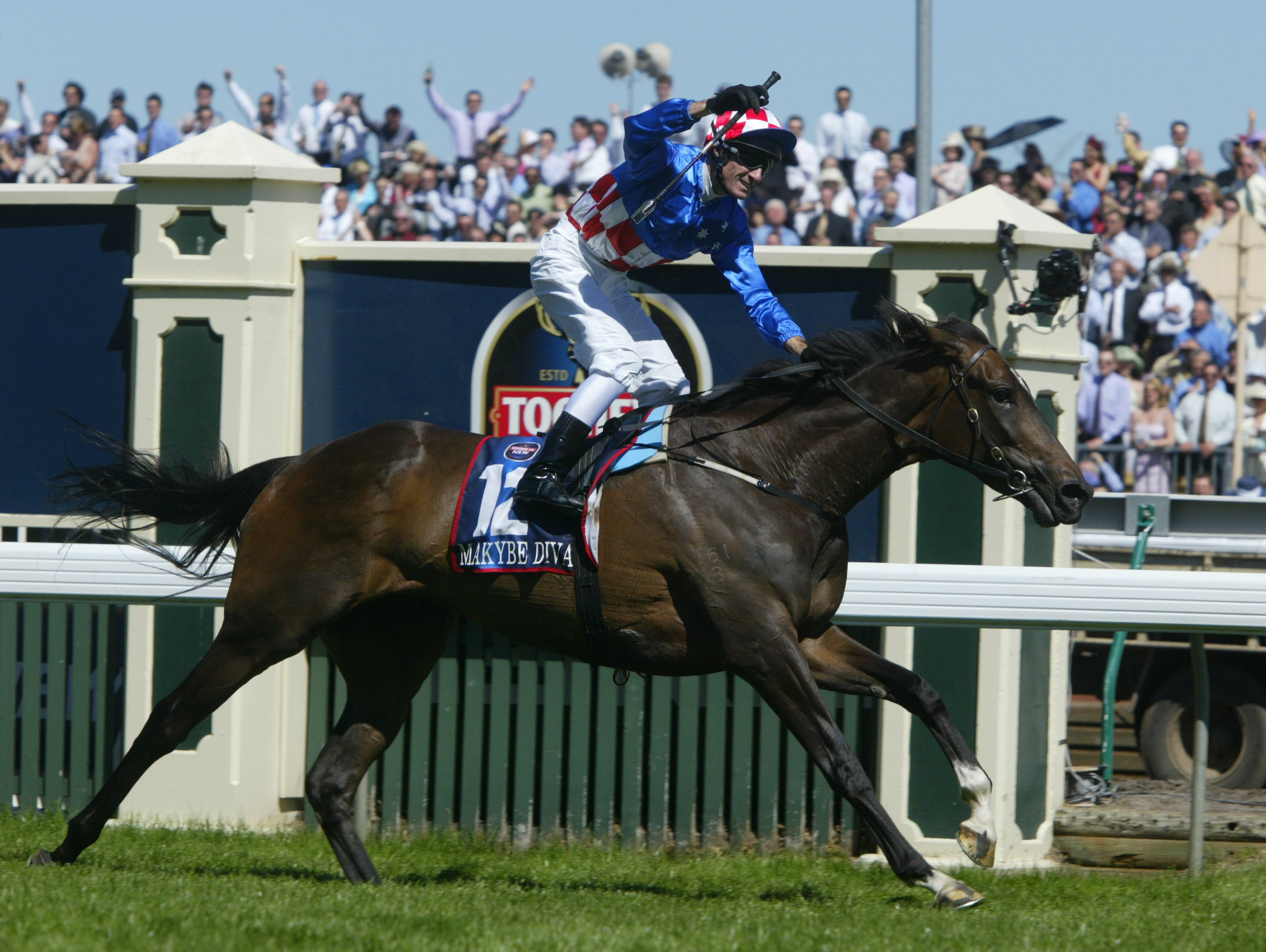 Makybe Diva and jockey Glen Boss celebrate in 2003.