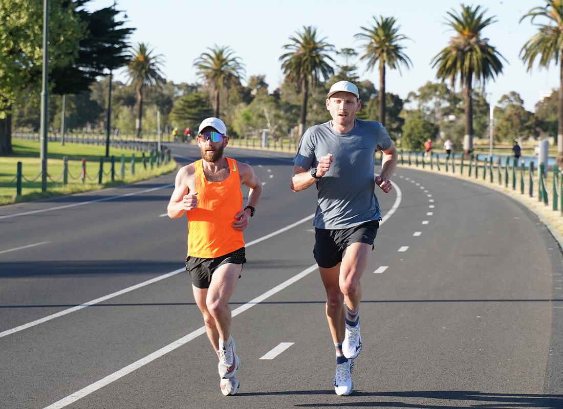 Reece Edwards (right) running at Melbourne's Albert Park with training buddy Dave Ridley.