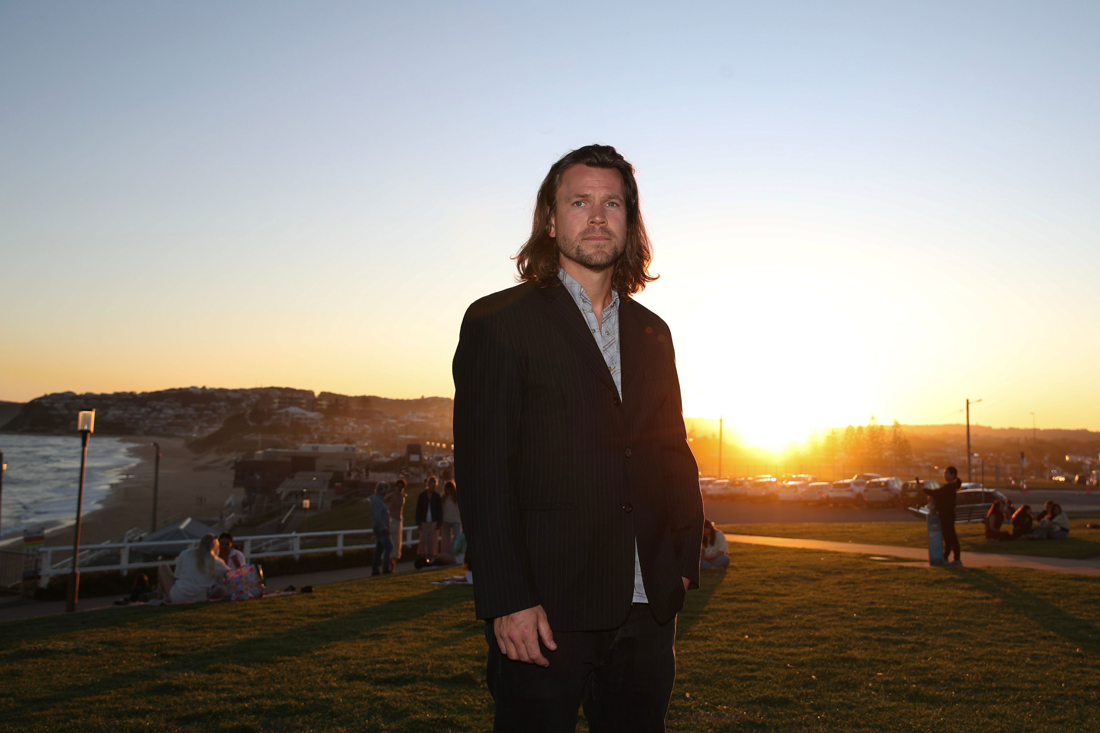 Joe Frost, survivor of the 2005 Bali Bombing poses for a photo during the 2025 commemoration memorial service for the 2005 Bali Bombing at Bar Beach on October 01, 2025 in Newcastle, Australia.