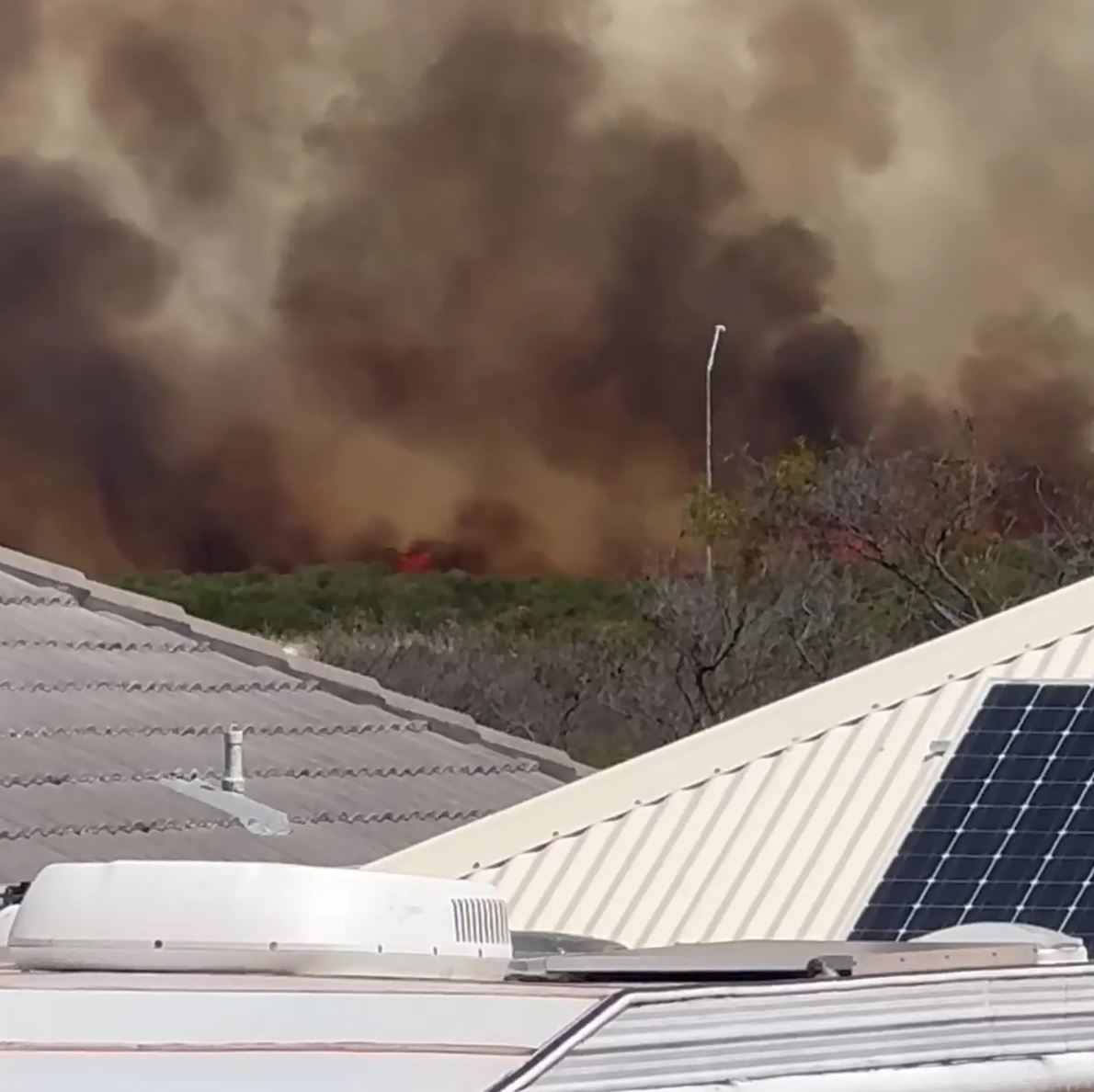 The view of the Port Kennedy fire in Perth, Western Australia from resident Miranda Morrison's yard.