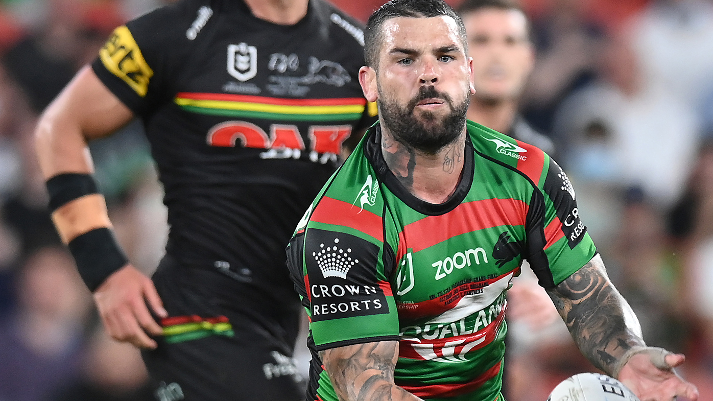 Adam Reynolds of the Rabbitohs offloads the ball 