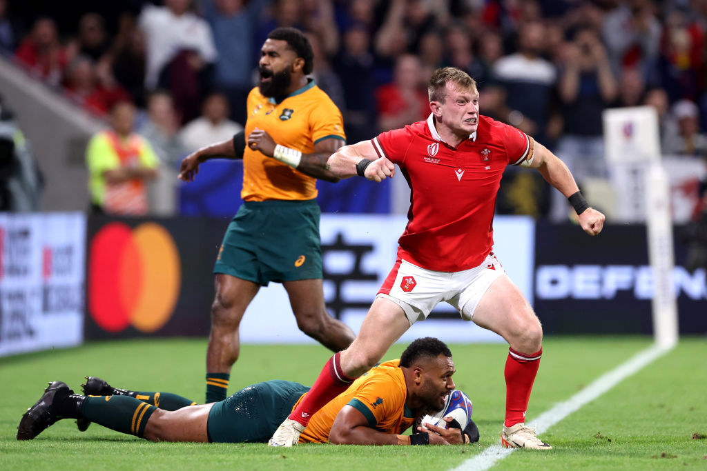 Nick Tompkins of Wales celebrates scoring in Lyon.