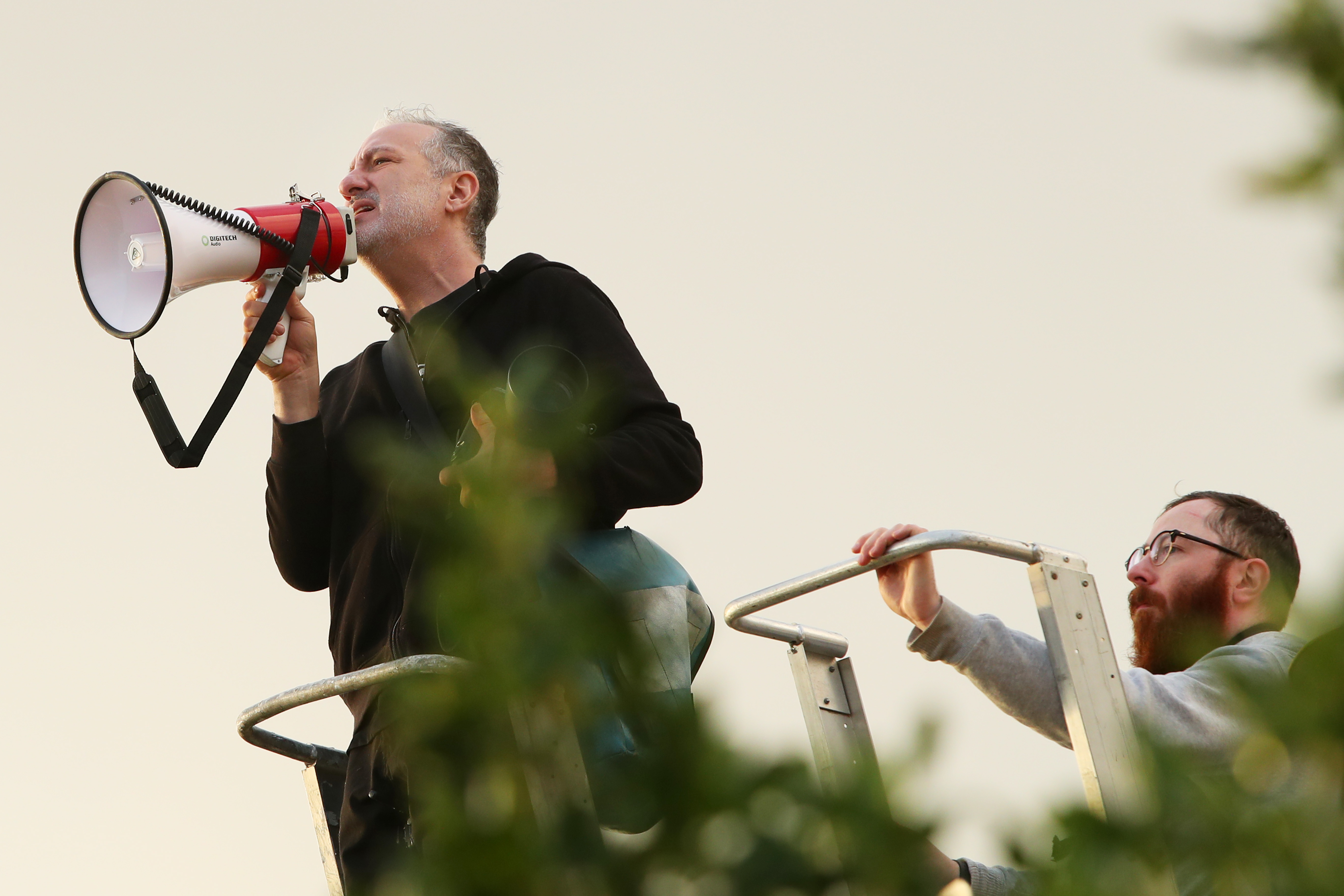 Thousands of people lined the shore and stripped off for a photoshop with renowned American photographer Spencer Tunick to raise awareness of skin cancer.