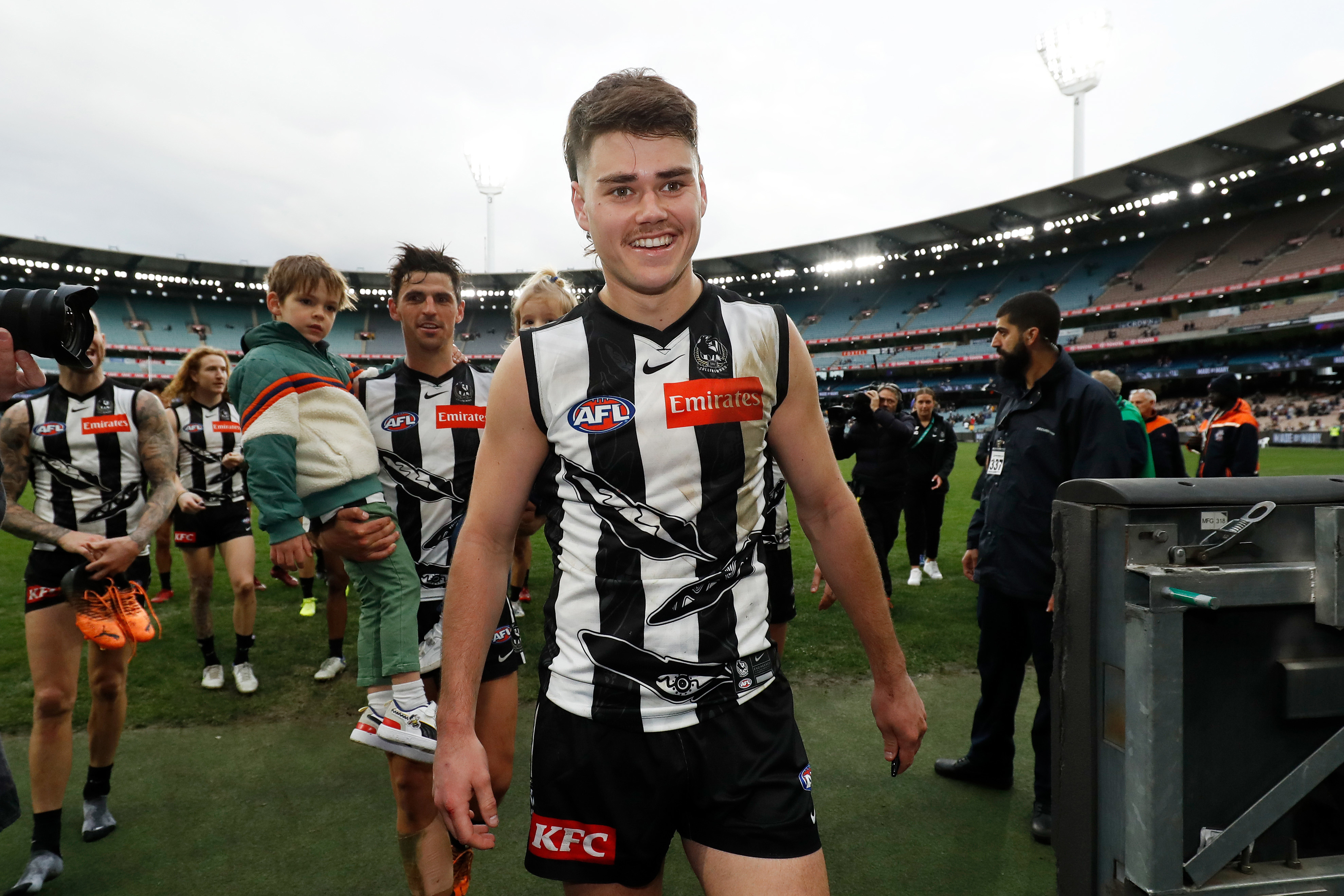 Josh Carmichael celebrates his first AFL win in 2022.