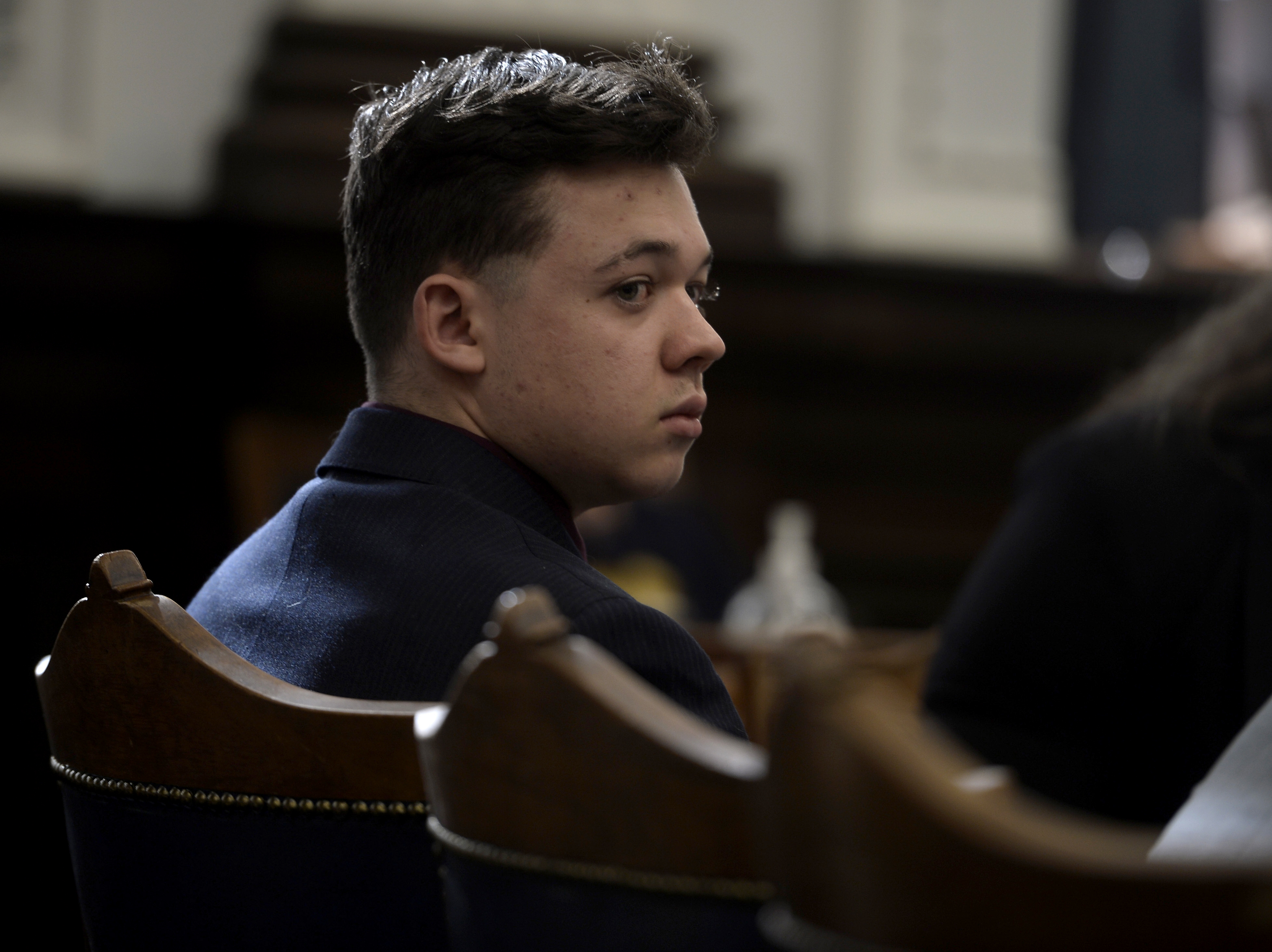 Kyle Rittenhouse listens as his lawyer gives opening statements to the jury at the Kenosha County Courthouse in Kenosha.